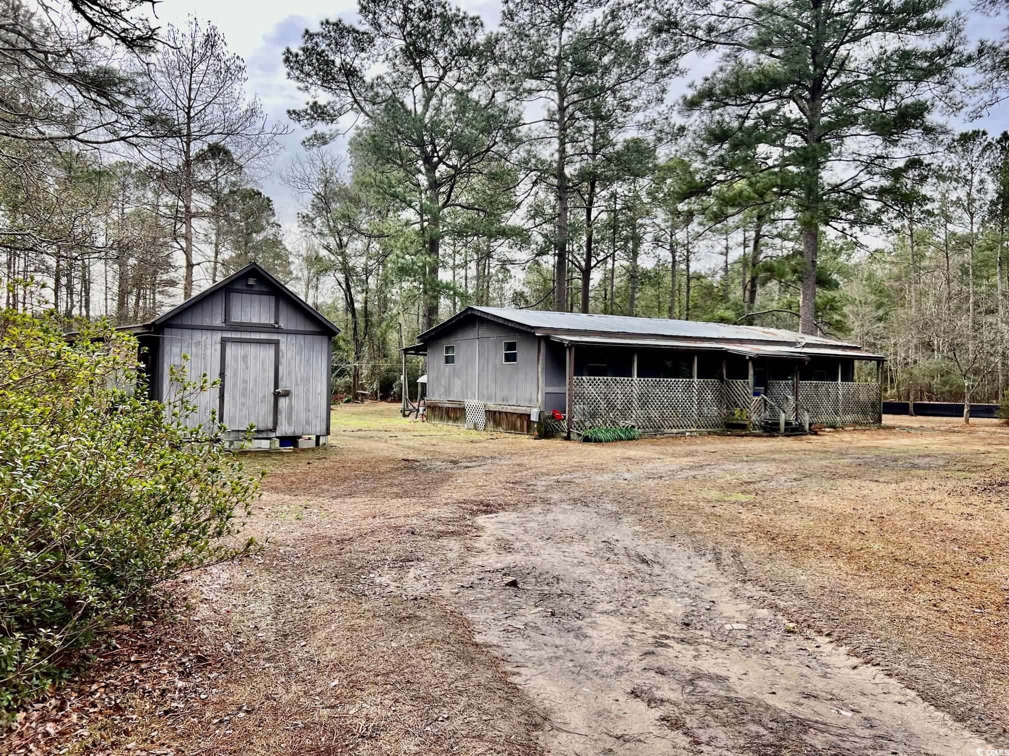 beautiful surroundings await. this is a chance to own acreage in the conway area on your own personal 4.45 acre tract. the home on site has had some updating and would make a great primary, secondary, or rental. neighborhood is quiet and peaceful. please contact agent for showing!