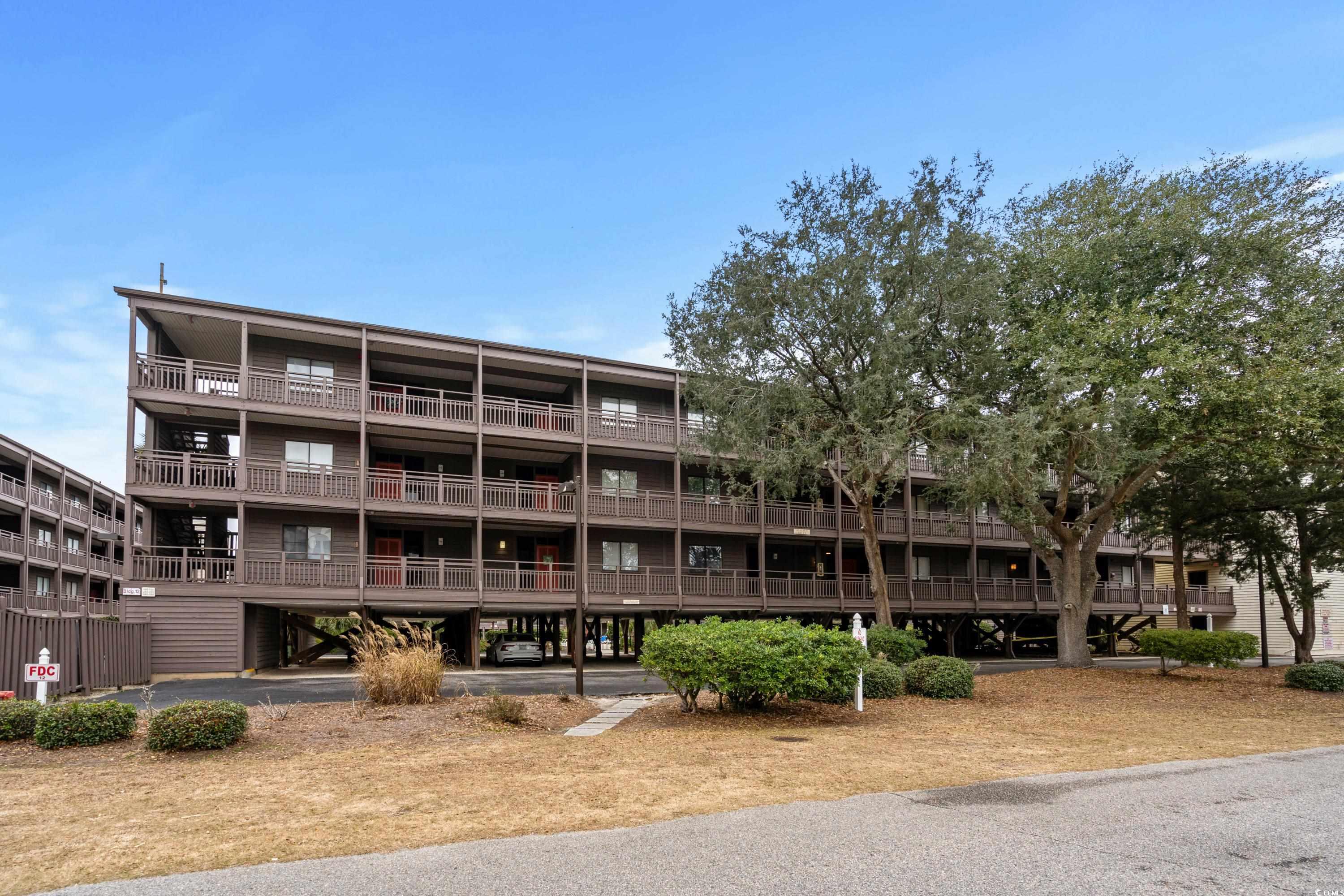 just steps from the beach and within walking distance to shops, restaurants, and live music on main st., is this first floor, 3 bedroom and 2.5 bath condo at the tilghman beach and racquet club resort. well maintained and never rented by current owners, this unit was fully remodeled in 2018 and the upgrades include granite countertops, stainless appliances (refrigerator replaced in 2022), wood plank tile flooring throughout, new raised vanities and toilets in all bathrooms, new tile in master bath shower and new tile in guest bath, new fixtures and hardware, new lighting, all doors and trim replaced throughout unit, and refaced cabinet doors in kitchen. also, the hvac was replaced inside and out. other stand out features: the standard hall wet bar has been converted to a full size closet so this unit has more storage than most, water heater was replaced in 2019, and the screened in porch, which overlooks one of the two resort pools and tennis courts, was fully reconstructed and refurnished in 2021. an electronic door lock is installed, and there is a 110-outlet wired at the ac unit for golf cart charging. a separate laundry/storage closet is located at the entry way. other amenities include elevators and luggage carts for each building, under building parking, and ample overflow parking. one of the two pools is oceanside, both pool decks have been recently rebuilt, and the courts are lined for pickle ball.  don’t miss your opportunity to see this gorgeous condo which is being offered with all the furniture so you can move right in!