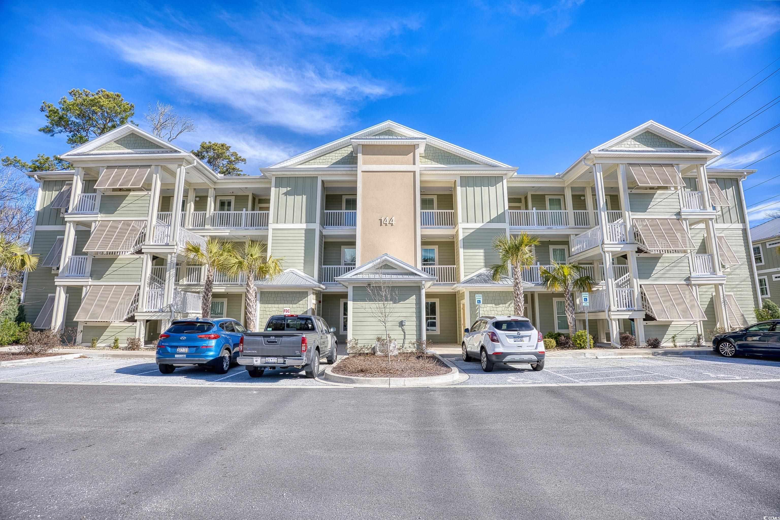 this is a fantastic opportunity to own a beautiful condo in pawleys island. this is an end unit with lots of light and a beautiful view of the lake and wetlands. the hardwood floors are an excellent feature that are even in the bedrooms. the kitchen has gorgeous cabinets that are soft close, granite counters, stainless appliances and a pantry. the spacious owner's suite features another great view, two walk in closets and a beautiful bathroom. the bathroom has granite counters and plenty of counter space. did i mention the view? you can also sit in the screened porch and take in the natural surroundings. there is a laundry room with commercial grade washer and dryer and a closet for more storage. plus, this unit has not been lived in! if you don't like stairs, no problem because there is an elevator. you can enjoy the community pool and the carolina weather or grill by the pool. make an appointment today, you won't be disappointed. square footage is approximate and not guaranteed. buyer is responsible for verification.