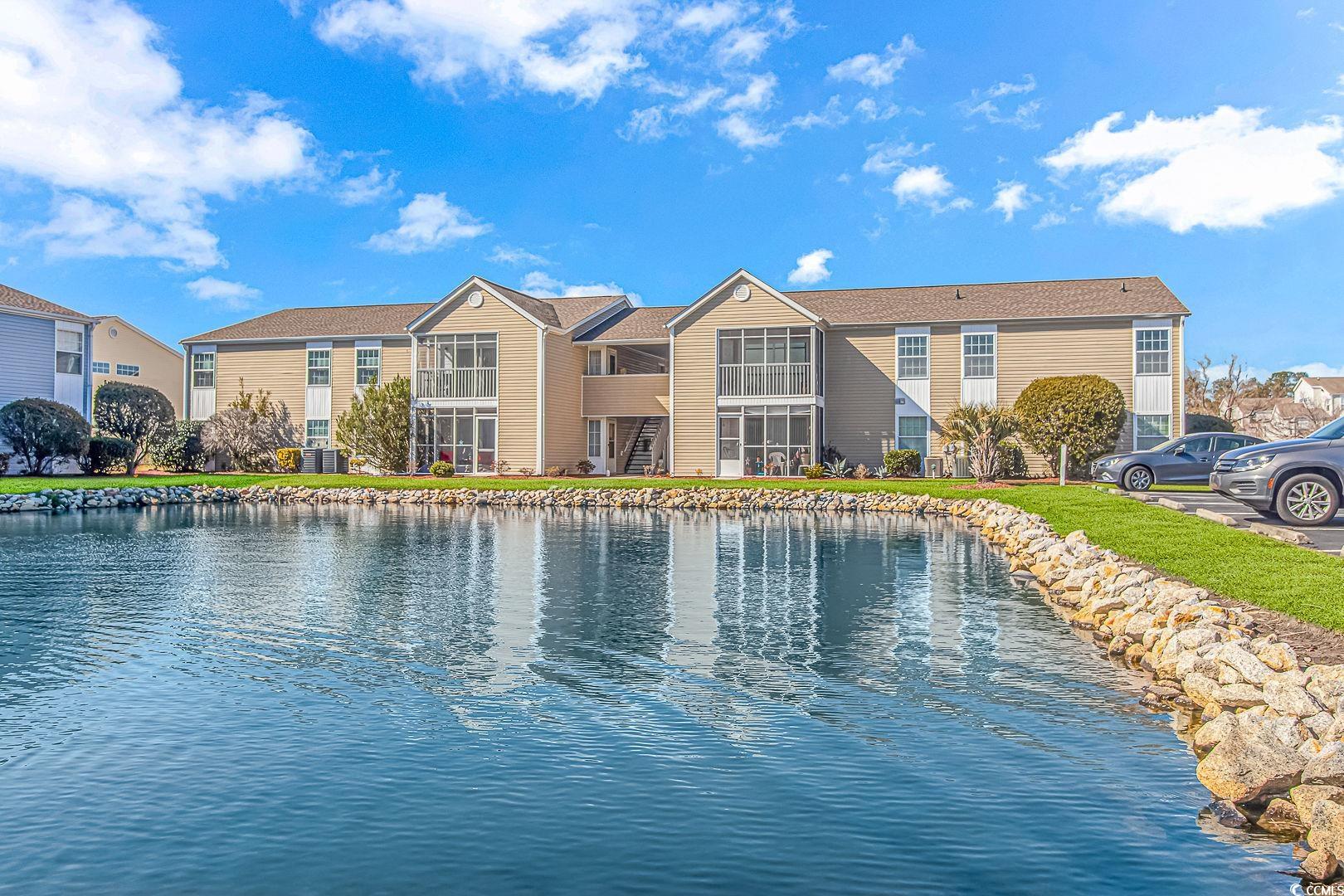 welcome to your own slice of paradise nestled in the heart of south bay lakes, surfside beach, sc! this captivating 3-bedroom, 2-bathroom condo is a haven of comfort and convenience, boasting breathtaking pond views that will leave you in awe. step through the door and immerse yourself in a haven of freshness, with newly painted walls welcoming you into an open-concept oasis. the kitchen, adorned with new counters and exquisite soft close cabinetry, seamlessly blends with the dining area and living space, creating an inviting atmosphere for gatherings and everyday living. the slider in the living room and  windows were replaced in 2017and bathe the rooms in natural light, infusing every corner with warmth and charm. step outside through the sliding glass door onto your very own screened-in balcony, a private sanctuary where you can bask in the serenity of nature and unwind amidst the tranquil sights and sounds of the surrounding landscape. retreat to the primary suite, where spacious proportions with closets that provide ample storage for your personal belongings. indulge in the ensuite bathroom, featuring a tub/shower combo, vanity, and a transom window that floods the space with soothing natural light, creating an atmosphere of pure relaxation. two additional guest rooms offer versatility, perfect for accommodating overnight visitors or crafting your ideal home office space. with easy access to the guest bathroom - updated in 2020, your guests will feel right at home. south bay lakes has outdoor community pools, a community observation deck on the large pond by the community clubhouse, and nature paths. nestled between hwy 17 business and hwy 17 bypass, this property offers convenience to the beach, all shopping, fun local eateries, the murrells inlet marshwalk, and attractions. don't miss out on this incredible opportunity to own a piece of paradise in one of the most sought-after communities along the south carolina coast. schedule your showing today and start living the coastal lifestyle you've always dreamed of! all measurements are not guaranteed and are the buyer's responsibility to verify.