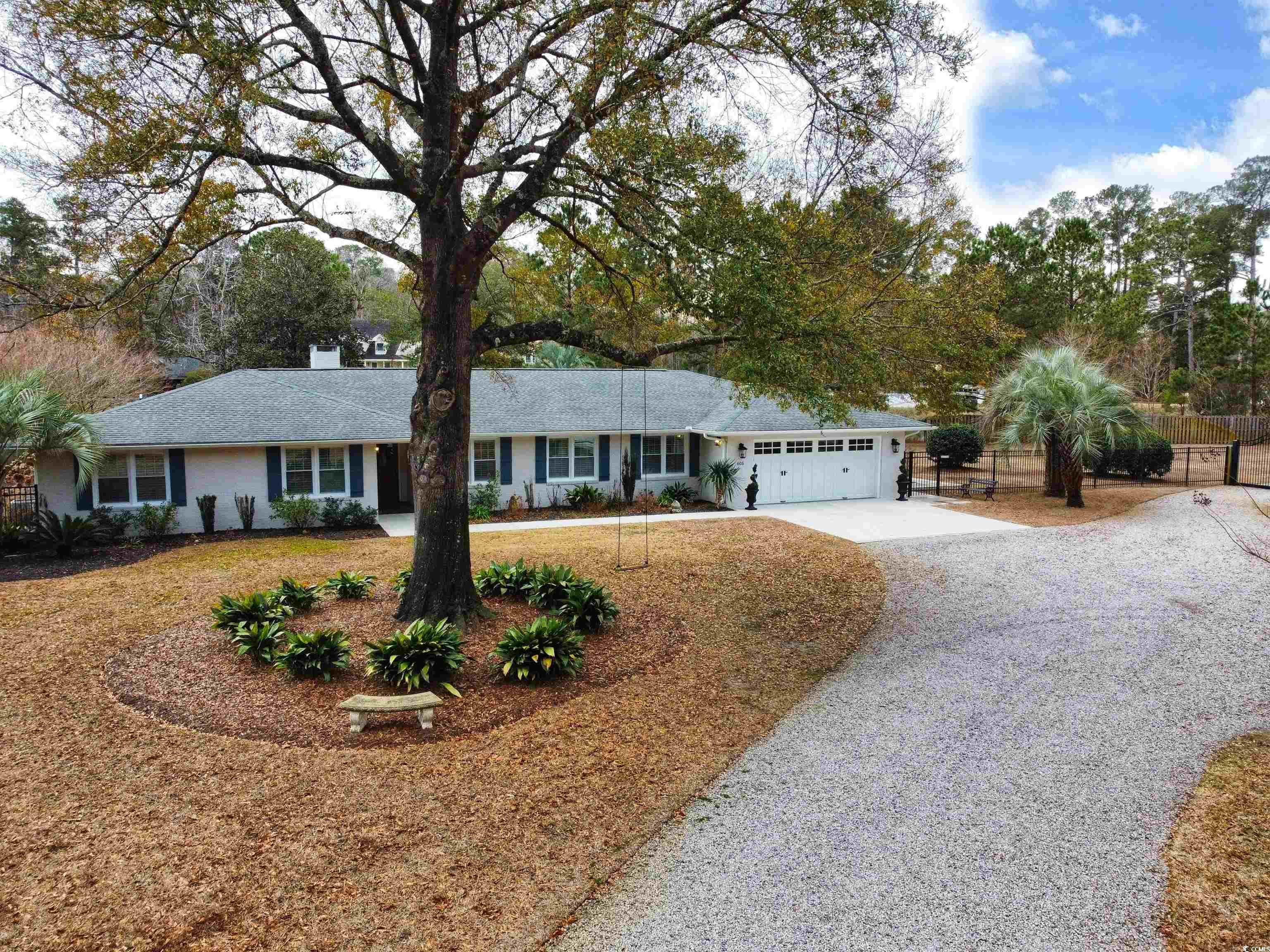 very well maintained and updated brick ranch home located on 1.13 acres in the heart of pawleys island, sc.  you will immediately notice the pride of ownership as you drive up.  plenty of room for your toys and space to add additional storage structures or even your very own pool.  this 4 bedroom, 3 1/2 bathroom home flows well from the moment you walk through the front door.  large great room and adjoining dinning room.  updated kitchen with granite countertops, brick backsplash, stainless steel appliances, large work island with breakfast bar and built-in wine rack and wine cooler, plenty of cabinets and pantry space as well.  living room off of kitchen.  large master bedroom with dual walk-in closets and sliding door access to the backyard.  master bathroom with tiled shower and separate sink areas.  en-suite bedroom with recently renovated bathroom with granite counter tops, new faucet hardware, and a tiled shower.  bedroom also accesses the back patio through sliding glass doors.  2 additional bedrooms for your guests or a home office.  3rd full bathroom was recently renovated with granite counter tops, new faucet hardware, a tiled shower as well.  sellers have recently installed one new hvac, a tankless water heater (propane), and a halo 5 water filtration system.  interior was recently painted and additional plantation shutters were installed in most areas of the home.  spray foam insulation added in the entire attic to help with energy efficiency.  other features to include lvp flooring, ceiling fans with lights in all bedrooms and screened-in porch (12x18) with views of the back yard, pond, and golf course.  brick pavers in the back yard patio areas and a firepit to enjoy on the cooler nights.  605 brace drive is minutes from the boat landing on hagley drive and a short drive to the beaches of pawleys island.  home is convenient to area shopping, dining, night life, and many area championship golf courses.  8 miles to georgetown, 20 miles to myrtle beach, and 70 miles to historic charleston.  make your appointment today and don't miss out on this amazing home and property!