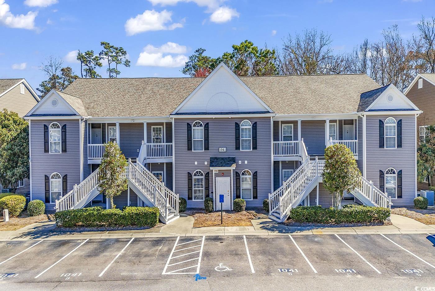 beautiful 3 bedroom, 2 bath condominium on the first floor, backs up to woods with a view of a pretty little pond from the screened porch in gated, pawleys pavilion. conveniently located right across the street from the community pool, enjoy the convenience of ground floor living with no steps!