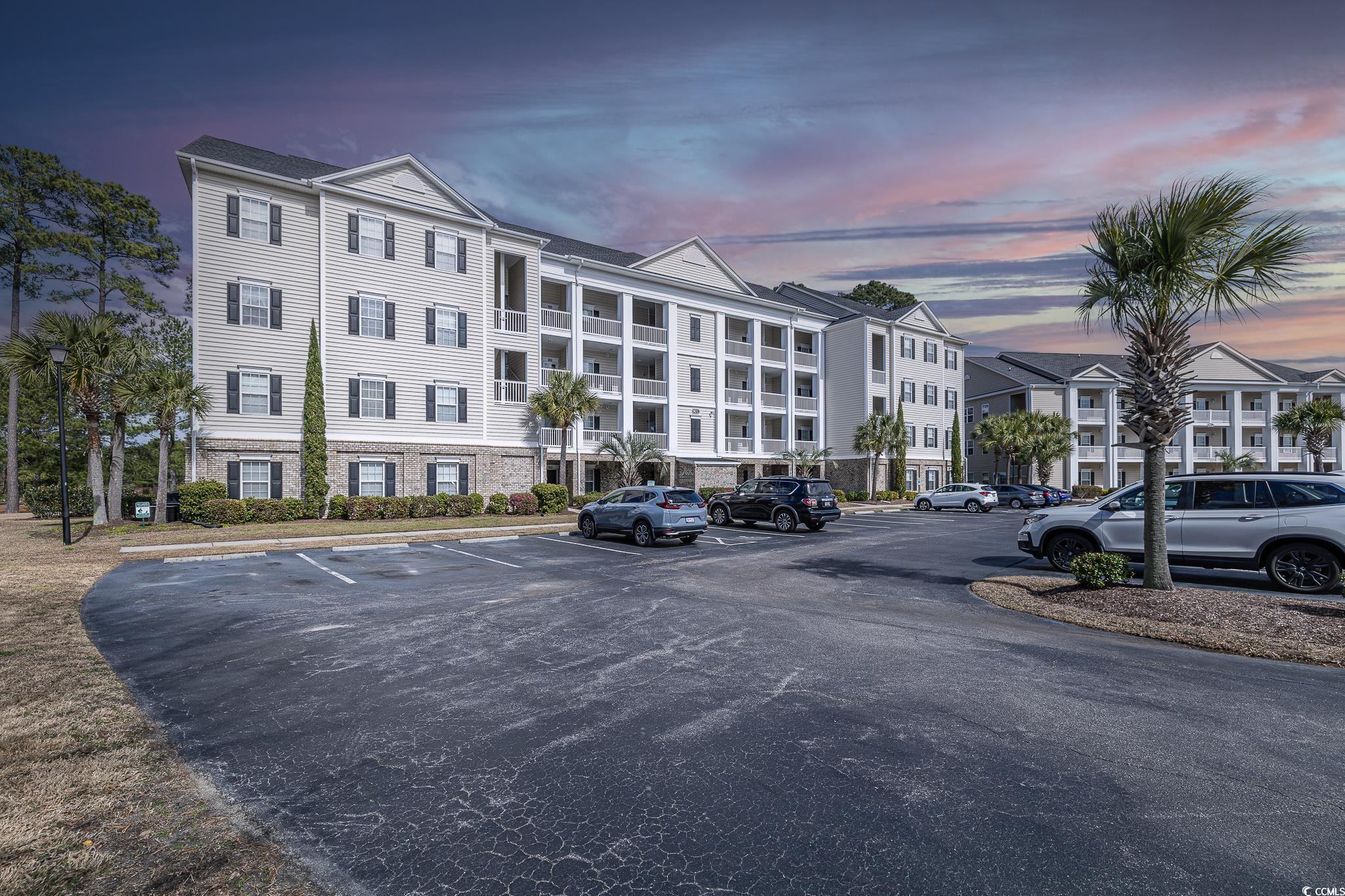 located in the heart of murrells inlet, this top-floor villa within the prestigious international club gated community redefines coastal sophistication with its vaulted ceilings and elevator access. a standout in a region known for the marshwalk, top-tier seafood, and garden city beach's calm, this penthouse features tasteful upgrades throughout. the kitchen shines with white cabinets and stainless steel appliances, while the spacious master suite boasts elegant crown moldings and leads to a luxurious bathroom with a soaking tub. the screened balcony offers serene views of the golf course and woods, making it a perfect spot for relaxation. this villa represents refined living at its best, ready for immediate occupancy in a highly desirable locale.