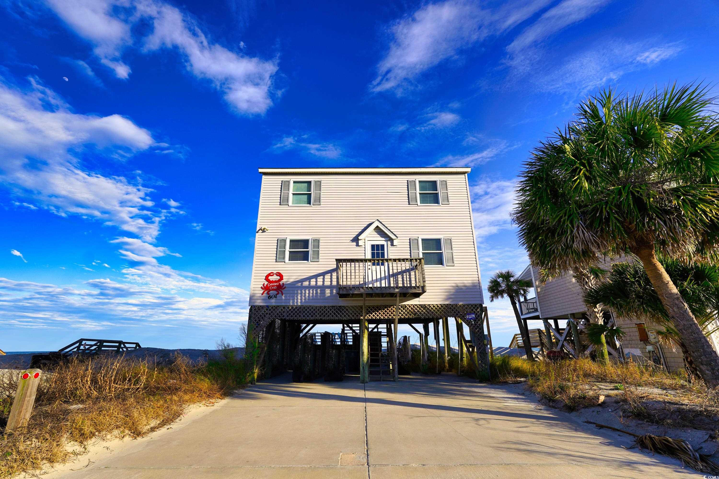 if you are looking for a beachfront property close to shopping, dining, marinas, the pier, and more, look no further! 601 s. waccamaw drive is a four-bedroom, two-and-a-half-bath home with spectacular views. the main floor offers living, dining, kitchen, and a half bath. additionally, there is access to a screened porch and open-air deck. upstairs, there are four bedrooms, two full baths, and laundry. be sure to check out the walking video tour of this property!