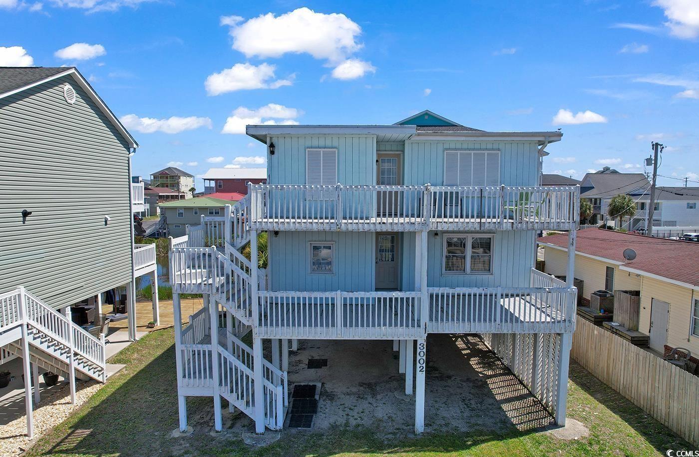 This is a great opportunity to make this diamond in the rough shine. Make this property the perfect beach get away. With the right renovations and your right personal touch this could be your get away and a great income property.  Situated just a few blocks from the Ocean in beautiful Cherry Grove North Myrtle Beach. This raised beach house offers two separate living areas both comprised of 3 bedrooms, 2 bathrooms, kitchen & living room that open on to the rear decks.  This home could possibly be converted from 2 units into one or keep it as is & use one as your second home while having a rental income. The property is located on the lake and short walk to the beach. The property is centrally located and close to all the amenities that Cherry Grove offers, great beaches, restaurant, local pubs and shopping, offering the best of what Coastal South Carolina is all about. So, if you're looking for your next vacation home, investment property, or primary residence this could be the one.