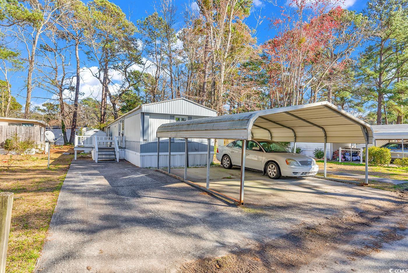 welcome to the murrells inlet community of windjammer village! this 2 bedroom, 2 bathroom manufactured home is ready and waiting for you to make it your own. there is a tremendous amount of opportunity waiting in this home with a spacious back deck, 2 car carport and 2 storage units in the back of the home. there is an all seasons room off the covered back deck, perfect for a game room, recreational area or man cave. you'll appreciate the spacious primary suite with his and hers closets and a large bathroom with double sinks and standing shower. windjammer village is in the heart of dining, entertainment and close to surfside, garden city and murrells inlet. enjoy being a golf cart ride to area beaches and the pool the community offers. part of the award winning st. james schools district, don't miss your opportunity to see this home today!