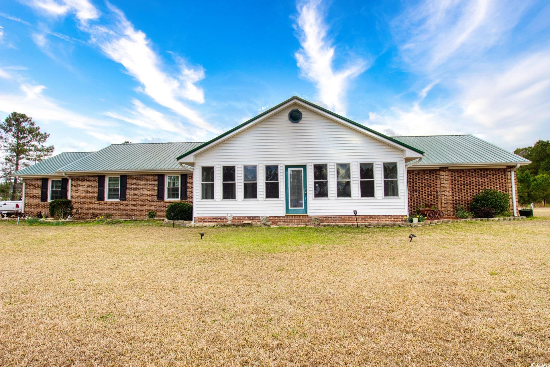 are you looking for your piece of paradise? this 2600 sq. ft., brick & vinyl sided, lakefront home sits on 1.07 acres, just outside conway city limits. # bedrooms, 2 full baths, includes many extras. large dining area & great room, kitchen with maple cabinets & stainless steel appliances, master bath with large whirlpool tub & 2 huge walk-in closets. there is also a large room with a separate entrance from the outside that has the ability to be used for many options. the home has a metal roof that is approximately 4-5 years old, whole house 16 kw generator, 2 stage hvac, halo water filtration unit, buried propane tank, new microwave & new dishwasher, stove, high efficiency washer & dryer & carport! enclosed front porch & heated & cooled carolina room in rear. tons of storage space! location of this home is excellent, being close to everything that conway & myrtle beach has to offer! make it a must see!!