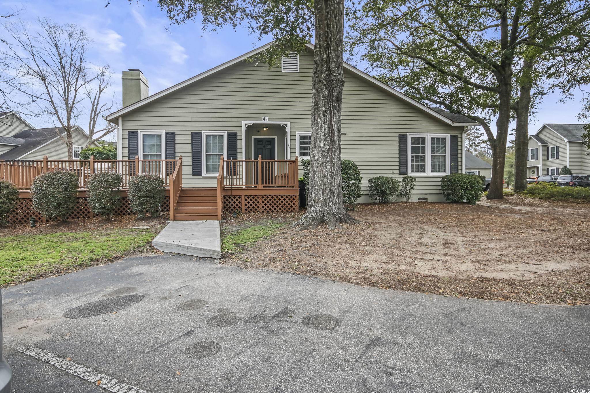 centrally located in murrells inlet, moss creek is in a desirable location, within close proximity to all the offerings on the famous marsh walk, great shopping, and fabulous restaurants. this is a single level end unit, with 2 bedrooms and 2 full bathrooms, with bamboo flooring in the bedrooms and throughout the main living areas.  this home offers plenty of storage, a laundry room off of the main hall, and a large eat in kitchen with granite countertops and room enough for hosting family and friends. sit back and relax on your large deck overlooking a quaint pond, after a day of fishing, or biking the trails offered through huntington beach state park or touring the famous grounds at brookgreen gardens. moss creek community amenities include a community pool and club house.