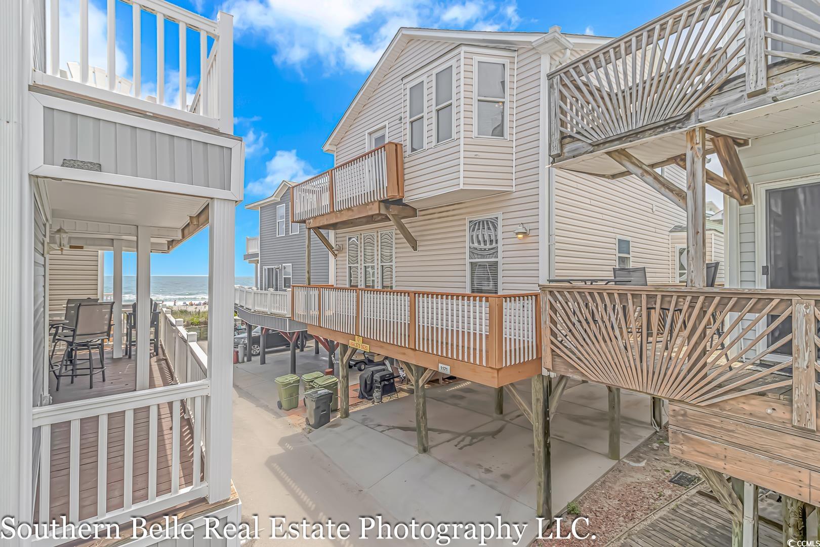 one of the few 7 bedroom 3 bath raised beach house in ocean lakes, 2nd house from the ocean!  amazing views of the ocean from the 4 decks, 6 of the 7 bedrooms have deck access with ocean views.  main level has a large living room, dining area, breakfast bar, and modern kitchen with granite counters and stainless steel appliances. full size washer and dryer located on the first floor.  1 full bath on the 1st floor and 2 bedrooms with their own access to the deck.  upstairs you will have 5 additional bedrooms and 2 full baths.  4 of the 5 bedrooms have access to the deck with ocean views.  home is being sold fully furnished.  both hvac units were replaced in 2022.  home has recently been remodeled to include stainless steel appliances, granite counters, lvp flooring in the living room, kitchen, and dining area along with updated fixtures.