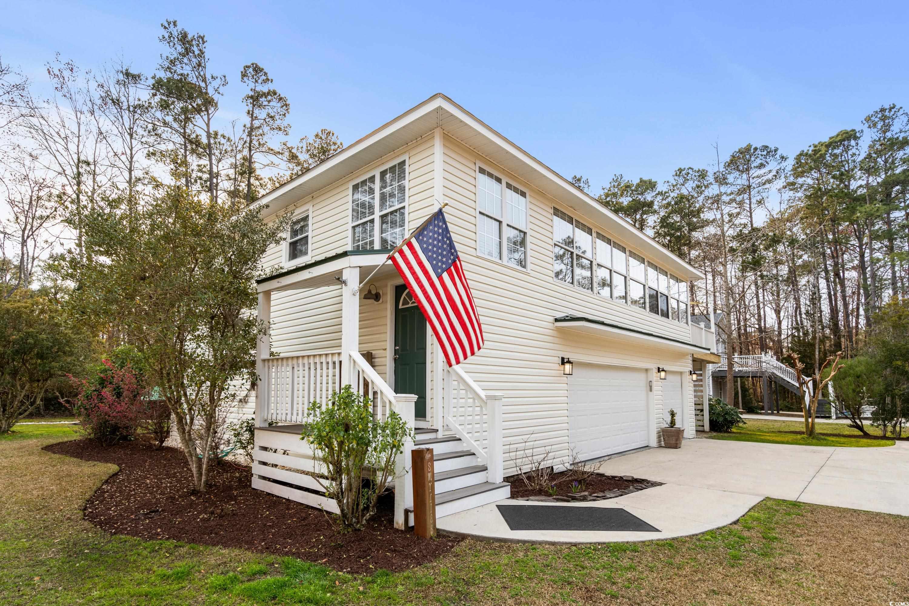 this coastal retreat offers features designed for an active yet relaxed lifestyle. this residence boasts 4 bedrooms and 3 full baths, complete with walk-in closets and an inviting low soaking tub along with a walk-in shower. the 4th bedroom is currently used as a den/family room, which could be a potential for a mother-in-law suite on the main floor. the property includes a 3-car garage and a carport, providing ample space for rv or boat/kayak storage.  inside, you'll find a spacious and open floor plan with a gleaming wood floor on the first level, complemented by tile in the bathrooms. the kitchen has been recently upgraded with granite countertops, a beautiful tile backsplash, and stainless steel appliances. enjoy abundant natural light streaming through numerous windows, creating a warm and welcoming atmosphere. outside, an expansive deck awaits for grilling and entertaining, overlooking a semi-fenced backyard with raised gardens, attractive landscaping.  the property also features a concrete pad patio with a grill and sitting area. situated in the desirable hagley estates, this home offers a secluded coastal lifestyle with swift access to the intracoastal waterway. whether you seek permanent residency or a vacation home, this community embodies the serene charm of the south carolina lowcountry. with a voluntary hoa, a convenient boat landing, and proximity to the beach and golf courses, take pride in calling this meticulously maintained property your home.