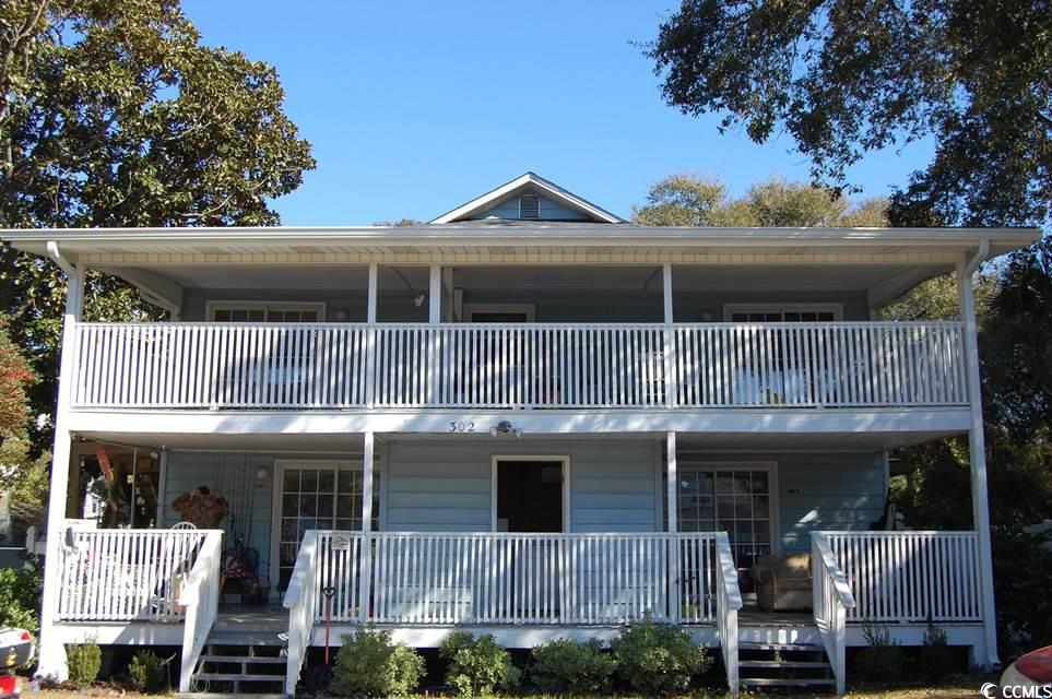 this is a cute two bedroom and one bath apartment on the second floor of a quadraplex in the windy hill section of north myrtle beach. it has a large front balcony and lots of trees. the beach is just 1 and 1/2 blocks away. this is a great location and good for the person who wants to walk on the beach and enjoy the salt air. off street parking, and there is shared laundry on the first floor. water/sewer and trash included. this apartment is not pet friendly.