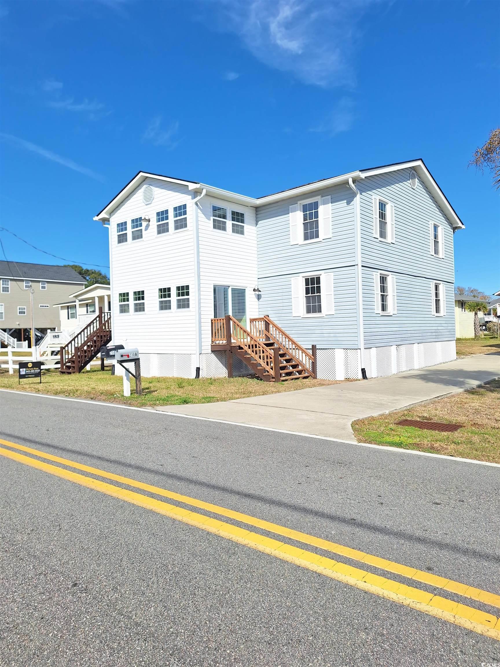 duplex-3/2 each unit!= 6 bdrm 4 bath-plenty of room for a pool and ample parking new fha guidelines allows 5% down on a duplex now!!! nicely remodeled 6 br/4 ba duplex located in murrells inlet walking distance to the beach. this vista drive property is the 12th home from the ocean! this is an up and down duplex. each unit has 3 brs and 2 ba. the two units are separate in that each unit is independently accessed from the exterior and the two units do not have interior access to one another. home would make a great rental property or live in one unit and rent the other unit!!! no hoa! walk to the beach!! new hvac upstairs and downstairs only 1 year ..new-roof is only 2 years old-all new stainless appliances on both levels, new gutters, new french drains, new flooring and ceilings scraped close to murrells inlet marshwalk and all myrtle beach has to offer weekly vacation rentals allowed!