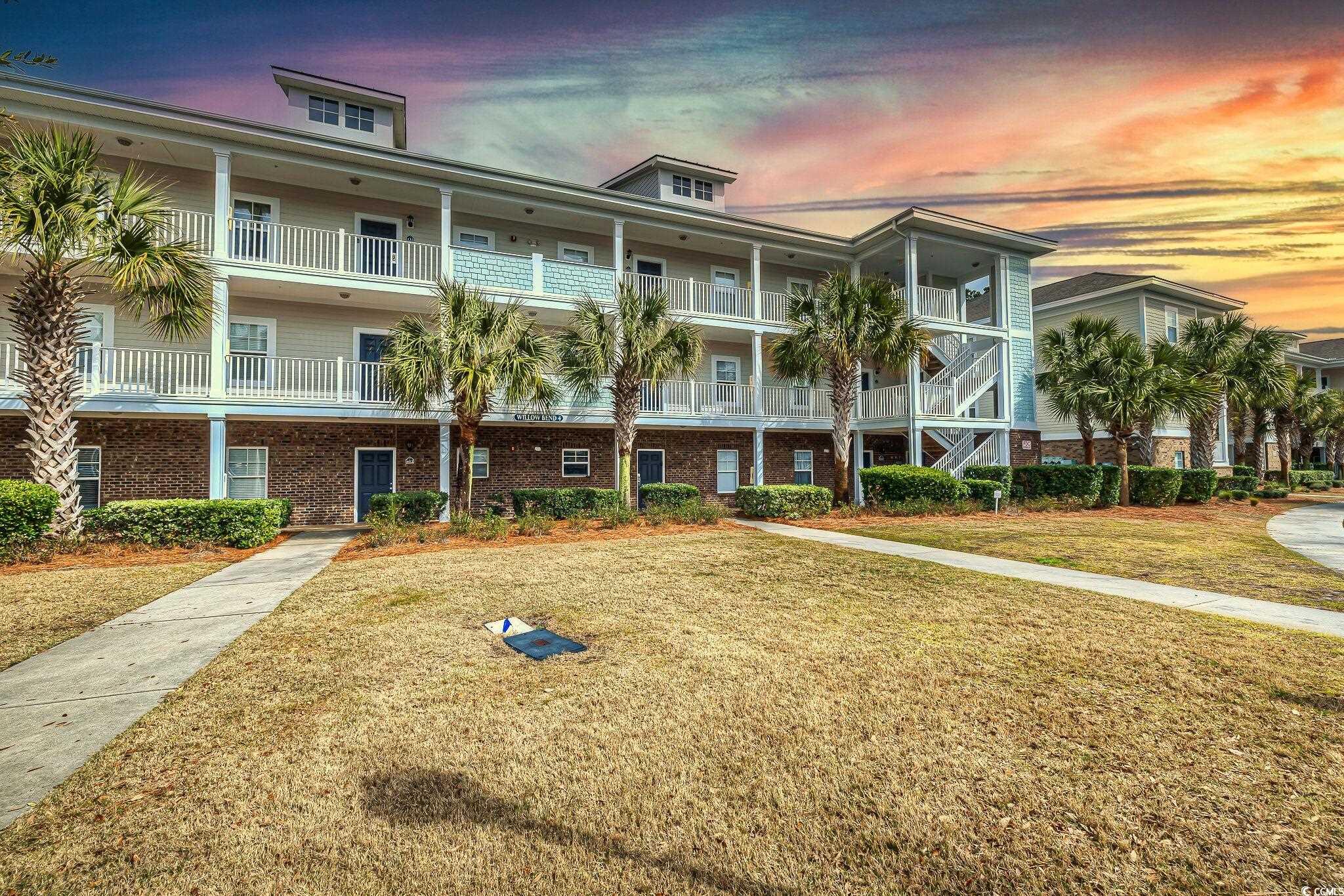 golf membership included - fully furnished - vaulted ceilings - discover tranquility and picturesque views in this inviting top-floor 2 bedroom, 2 bathroom golf villa located in the peaceful willow bend community at barefoot resort. the villa showcases vaulted ceilings and a bright kitchen equipped with white cabinetry and stainless steel appliances, creating a welcoming atmosphere. offered fully furnished, this home is ready for you to move in and enjoy.  barefoot resort is renowned for its comprehensive array of amenities designed to enhance your lifestyle. this includes access to four championship golf courses, a driving range, a fitness center, diverse dining options, a full-service marina, an expansive 15,000 square foot swimming pool plus an exclusive pool for willow bend residents, seasonal shuttle service, barefoot market, a medical office, and much more.  positioned just across the intracoastal waterway, you are mere moments from the vibrant shops, restaurants, and entertainment options at barefoot landing. additionally, the beautiful beach is just a five-minute journey away, ensuring the best of both worlds: serene resort living with easy access to coastal enjoyment.