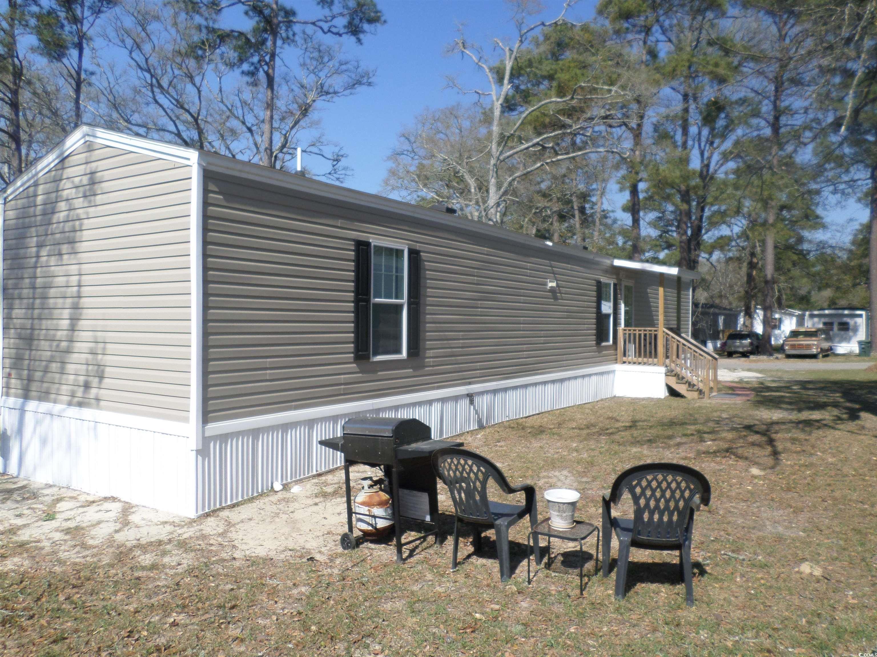 motivated sellers. price improvement!  beautiful 3 bedroom 2 bath 2022 scotbuilt manufactured home is set up in the sought after leased land community of creekside mhp in north myrtle beach, sc.  the home has an appliance package to include range, microwave, dishwasher, and refrigerator.  the master bedroom is located on one end of the home while the second and third bedrooms are constructed on the front end of the home.  both bathrooms have tub shower combinations and vanities. the vinyl flooring flows nicely throughout the home and is easily maintained.  the open floor plan is great for entertaining while cooking and dining.  the neutral color tones will mix and match with any furniture or decor.   the lovely ceiling fans offer additional elegance and cooling throughout the home.    the two wooden 4' x 6" decks are easy accesses to the front and rear entries of the home.   an additional roof top deck cover was added to the home for weather sheltering and curb appeal. this lovely property would make a fine permanent residence or vacation home.   creekside community boasts a swimming pool, onsite mail boxes, playground area and views of the marsh down by the clubhouse.  pets, golf carts, motorcycles are welcome with community approval. fences and a storage building may be added to the property with community approval as well. land lease is paid until 1/1/25.  call for more details and to schedule your private viewing today.  a must see.