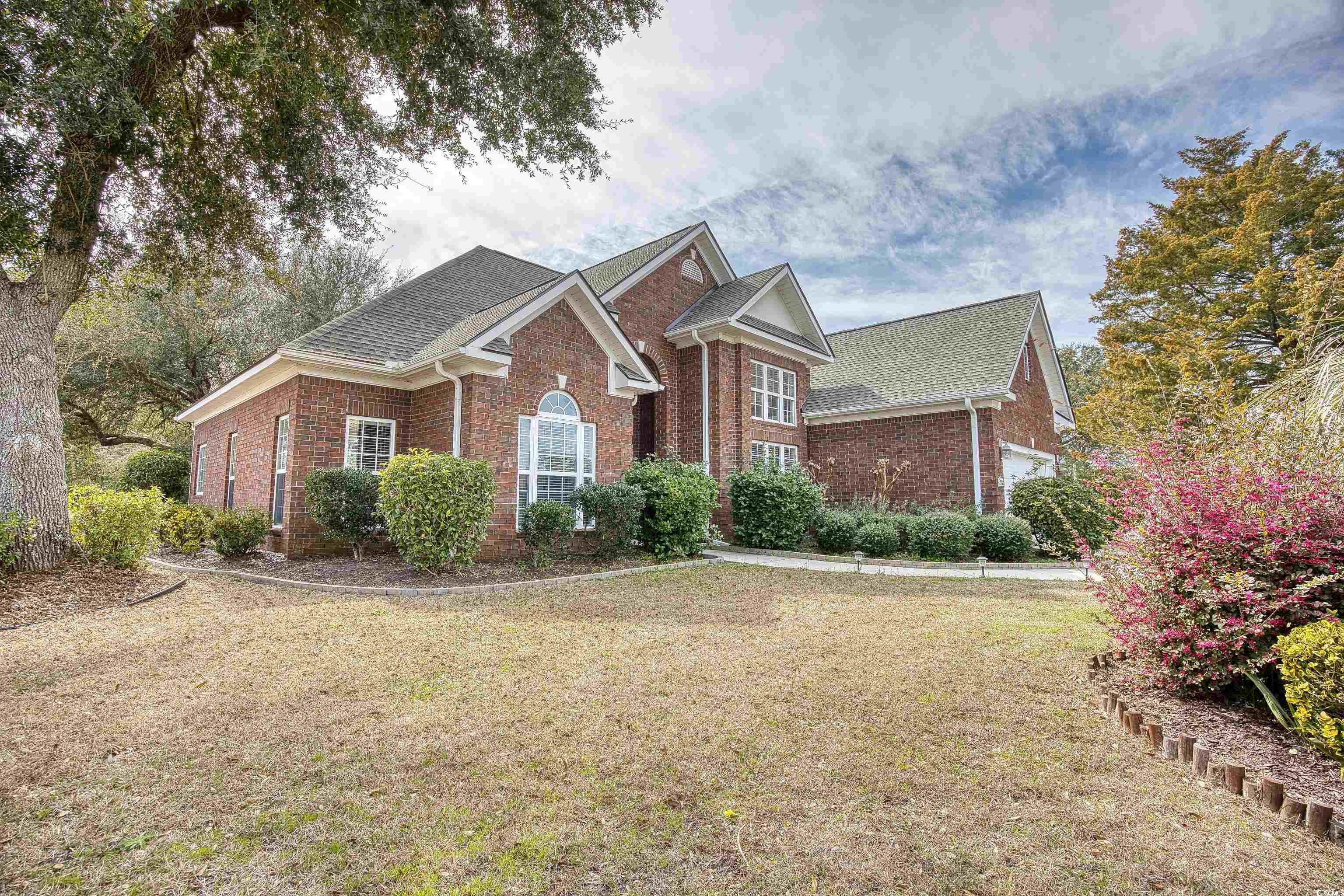 this beautiful single level brick front home is just steps to the atlantic intracoastal waterway and a short 2 mile ride to the beach. large lot with private patio & outdoor fireplace. no hoa. high ceilings, new roof 2023, split floor plan, eat in kitchen and formal dining area, wood floors in great room & formal dining area and italian tile floors in kitchen and breakfast area. perfect size & location!