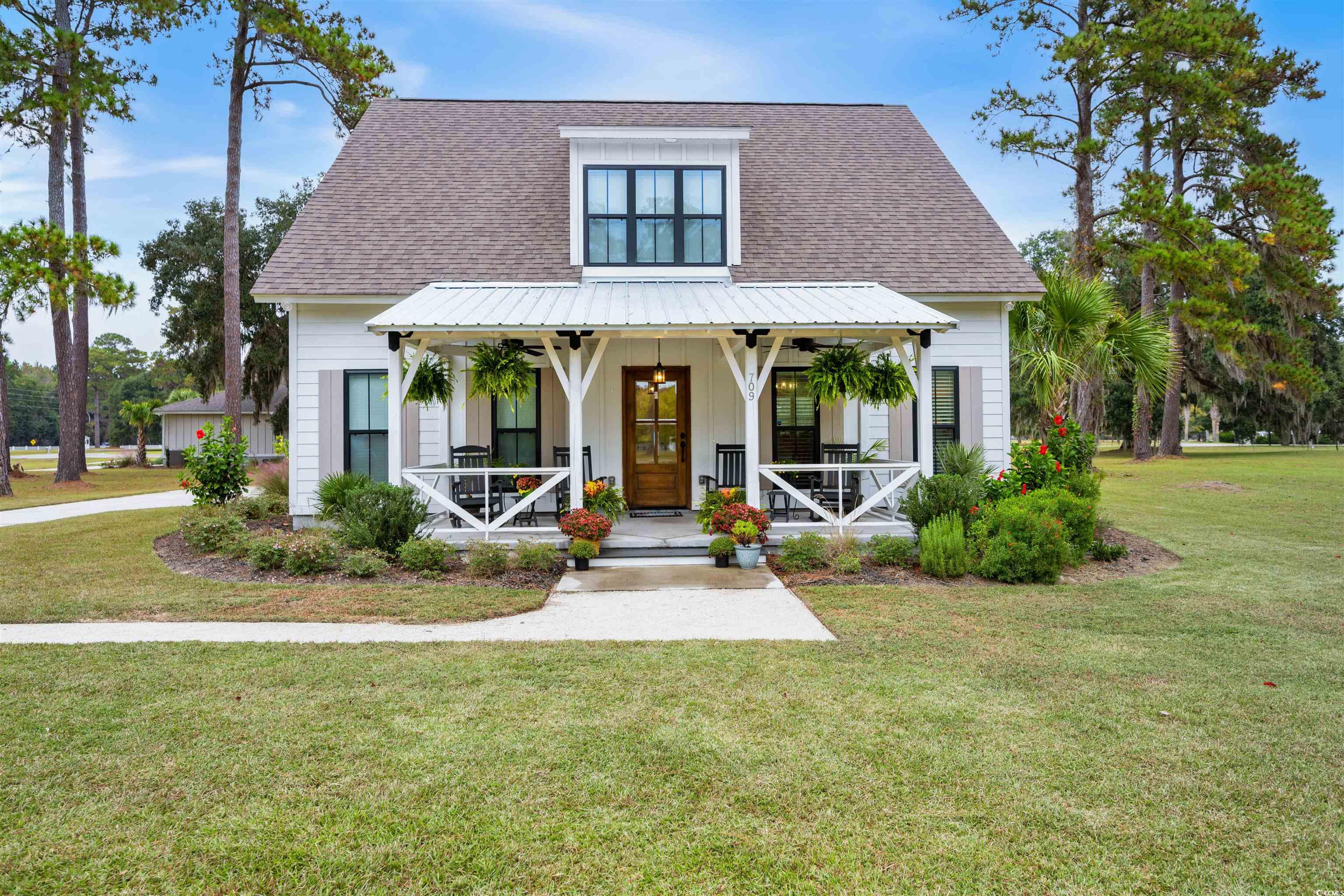 here it is-the home you've been searching for. the perfect blend of southern charm, modern comfort and a serene community dock overlooking the winyah bay. situated just outside of historic georgetown, sc, this home is a true gem inviting you to experience the best of coastal living. south island plantation is nestled on the banks of the winyah bay with wide sweeping views of the bay and open green space. imagine waking up to the sounds of birds chirping and watching breathtaking sunsets from your backyard. this 1.5 story home offers generous living spaces with a gas fireplace and open concept making it perfect for families or those who love to entertain. with three bedrooms and two and half baths and a large den/office space upstairs, there's plenty of room for everyone. the home's design reflects the perfect fusion of traditional and contemporary elements. from the charming front porch, to the sleek interior finishes, every detail exudes class and sophistication. the spacious, well-appointed kitchen features custom cabinetry with soft close drawers, stainless steel appliances, granite countertops, a large island, and a pantry with a sliding barn door. the owners suite is a sanctuary of comfort with a spacious bedroom, walk-in closet and spa-like ensuite bathroom with a no-lip walk in shower. two additional bedrooms upstairs share a lovely bathroom with a large bonus space that can be used as a den, office or playroom. also upstairs are two large storage closets. the backyard is designed for outdoor living, with a trex deck and screened porch and also an open patio area that is perfect for grilling and enjoying the natural beauty of the area. no need to worry about mowing the grass. you can choose to use the hoa provided lawn maintenance service for a minimal fee. located near the charming town of georgetown, sc, you are just a short drive away from the historic district, boutique shops, restaurants, public boat ramps and all the amenities you could want. inside the gates of south island plantation, you can enjoy the gorgeous clubhouse, swimming pool and jogging/walking trails at your convenience. 709 belle rive rd represents an incredible opportunity to own a piece of coastal paradise. it seamlessly combines modern living with classic charm and offers unparalleled views of the winyah bay from the community dock. don't miss your chance to make this stunning property your new home. the lot next door to this home, lot 9, is also available for sale. charleston, sc is 60 miles south and myrtle beach is 60 miles to the north. a municipal airport for private airplanes is located 3 miles away.