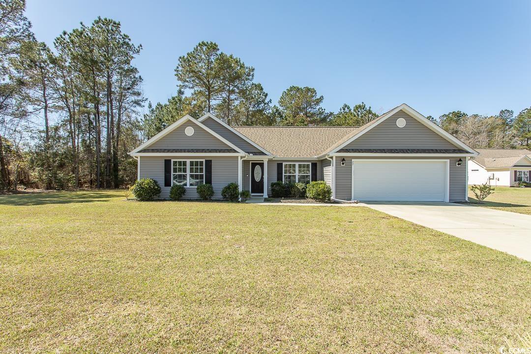 welcome home to this wonderful 3 bedroom, 2 full bath home on almost a full acre (.87) lot in the lovely gated community of yauhannah landing! this home features an open living area with a vaulted ceiling and plenty of natural light. the chef of the family will love the modern kitchen with stainless steel appliances, plenty of counter space, and a breakfast bar. the master suite offers a tray ceiling, walk-in closet, and an ensuite bath. with the popular split bedroom plan, the other two bedrooms share access to the second full bath. in the outdoor space,you can relax on your private porch and enjoy the forest view beyond the fenced back yard. extra attic storage is conveniently located above the garage. the garage is a 3 car tandem garage! yauhannah landing is nestled on the edge of waccamaw national wildlife refuge with beautiful unspoiled land along the great pee dee river and yauhannah lake. a serene and grreat location, yet only a short drive to reach the beach and all the shopping dining and entertainment the grand strand has to offer! also, this home is usda eligible, which allows 100% financing!