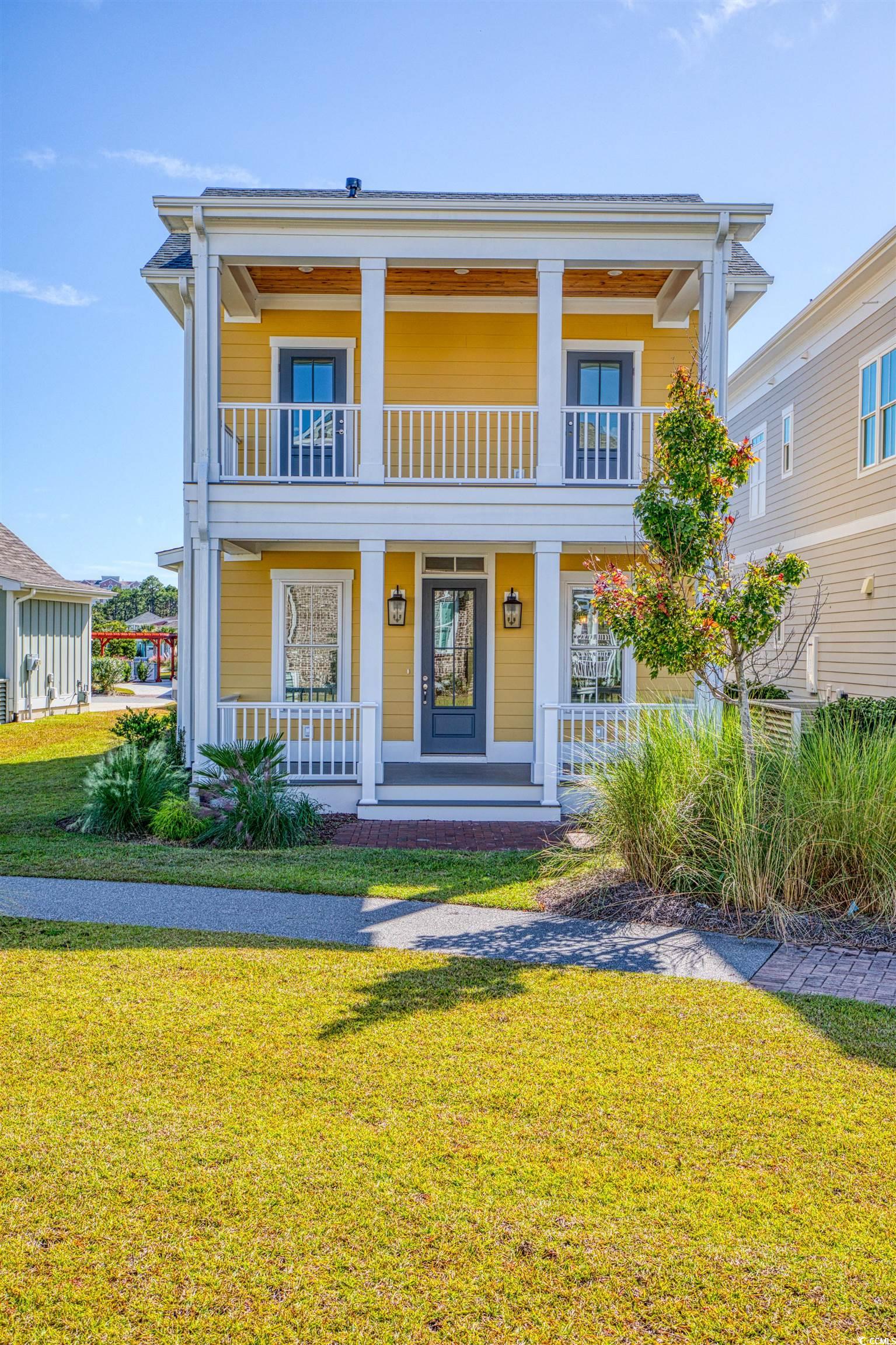 this to-be-built home will feature the charleston plan situated on lot 61, offering a beautiful water view from its 2nd story porch. this home has a heated area of 1,826 sq ft and features an open floor plan with 3 bedrooms, including a primary suite on the first level and 2 generously sized bedrooms upstairs that lead to the porch through single glass paned doors in each room. structural upgrades selected for this home include a natural gas fireplace located on the ground floor. upgraded lighting, quartz kitchen countertops, stainless steel chimney hood over the gas range, and engineered wood flooring throughout are among the interior features. the community offers thoughtful design with unprecedented amenities throughout, including a zero-entry free form swimming pool with a tanning shelf, a well-appointed clubhouse, miles of walking trails, 10 acres of lakes, and green spaces. located in an x flood zone and less than a mile from the beach and grande dunes ocean club. this location also offers convenient access to the grande dunes marina, golf courses, and several major marketplaces with groceries, pharmacies, shopping, dining, fitness, health care, salons, and more. live local, live smart, living dunes. photos are of prior model home of the charleston and for illustrative purposes only. all measurements and square footage are approximate and not guaranteed. buyer is responsible for verification.