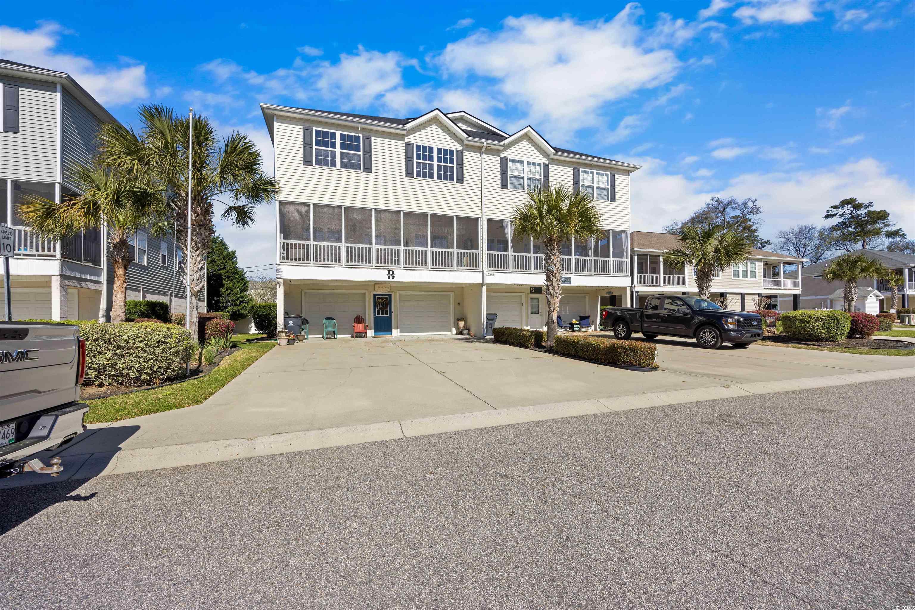 this is it, the one you've always dreamed about! located in the serene neighborhood of kelly court villas. just a short golf cart ride or walk to the beach with public access, golf cart parking, and only 1.4 miles to the garden city pier. its perfectly located, kelly court villas offers 2 community pools and a low maintenance lifestyle as lawn care is handled by the hoa. this pristine residence has never been rented and has had only one owner. it is a rare find with 4005 sq. ft under roof. the bottom floor consists of an enclosed garage large enough for 2 cars, your golf cart, and all your beach toys.  the entrance door leads to a stairwell with access to the second floor. also on this level is a laundry room, hallway to the door leading out to the rear of the unit, and a storage room containing the hot water heater. on the second level, your will find a half bath, master bedroom, master bath with walk-in shower and whirlpool tub, and master closet. towards the front of the unit is the open floor plan living room, dining and kitchen. a screened porch stretches across the front of the unit. it is perfect for rocking and watching the palm trees sway as the gentle ocean breeze blows through. the third floor consists of a 2nd living area and 4 bedrooms each having its own bathroom. both hvac units have been replaced (2019 and 2021). the hot water heater was replaced in 2022 and the roof replaced in 2024. the carpet downstairs was replaced with waterproof laminate in 2019.  there's room for all of your family and friends. you won't find anything else this spacious at this price and this close to the beach. nothing else compares!