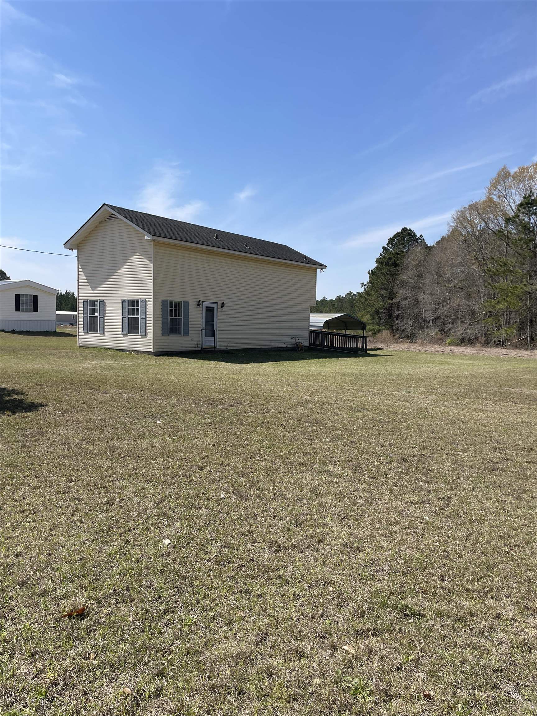 this is a 1 bedroom 2 full bath that has a room off the kitchen that could be used as a second small bedroom. the lot is almost an acre and could be subdivided to put another home on.  subdivision of property and all permitting and permits would be buyers responsibility. it is not in a flood zone and has no hoa. nothing on the market at this price with this much land in this area. all measurements are the responsibility of the buyer.