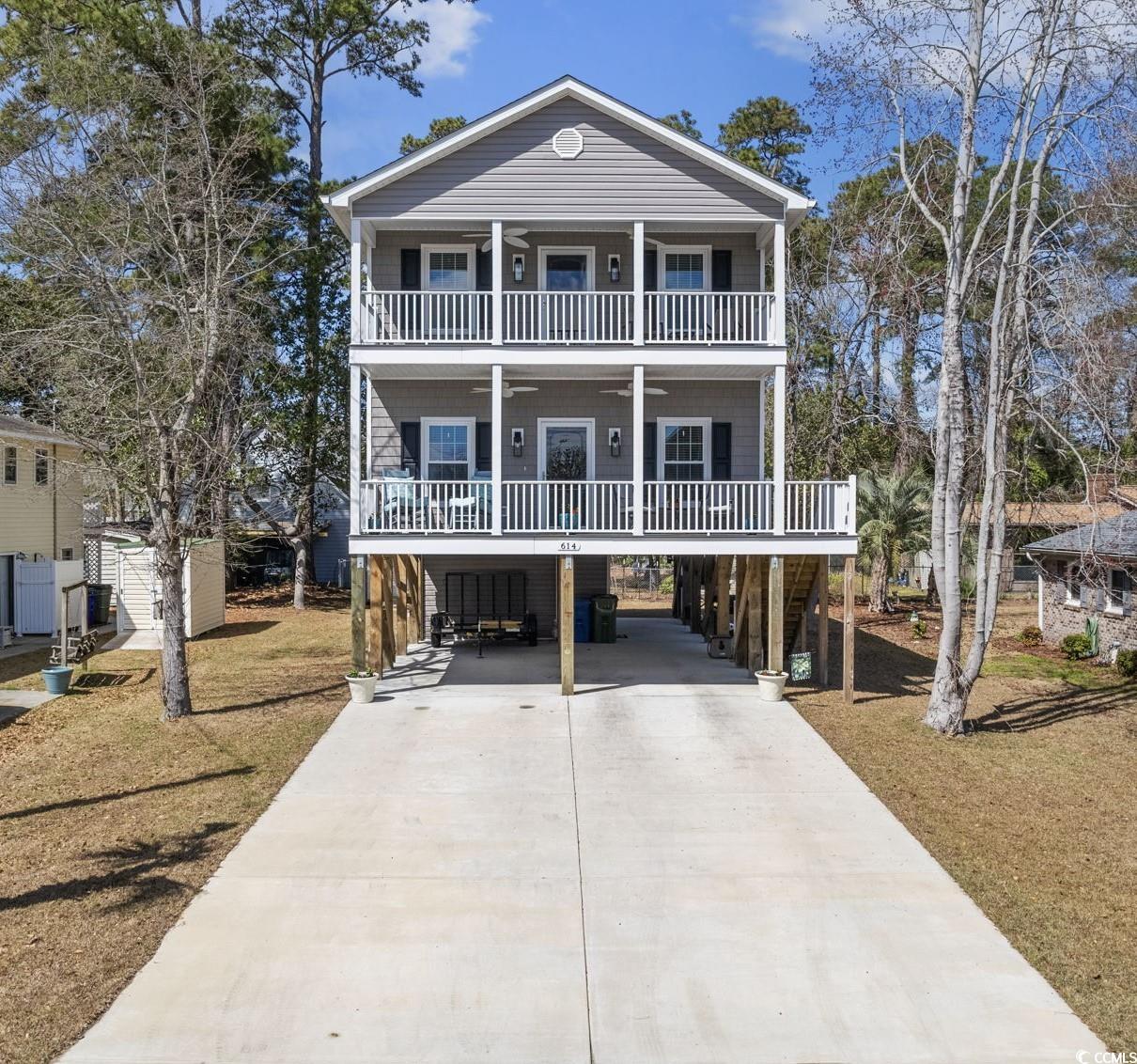 relax and breathe in that healing salt air from this like new, (built in 2022), 4 bedroom, 4.5 bath home only 3 blocks to the beach! home has 2 large east-facing covered porches (with ceiling fans) and yes, you can see a little bit of blue/ the ocean from the upper porch! enjoy the beautiful and expansive layout in this immaculate home boasting a huge living room with dual ceiling fans, 3 large primary/master bedrooms (1 down and 2 up) with spacious ensuites and large walk-in closets (one of which opens to the private, upper covered porch) plus a 4th bedroom with private bath and closet! gorgeous granite countertops and high-end, waterproof lvp flooring throughout this amazing home! updated, modern kitchen with pantry, custom slow-close cabinetry, stainless steel appliances, large granite island and very spacious dining area as well. 2nd floor has a large additional hall closet space to store whatever you need. home has a very nice laundry room with extra closet, half bath and white maytag, large capacity, commercial technology washer/dryer! attached exterior storage room that can be accessed at the base of the interior steps or from outside. detached storage shed with electric & large enough to store a golf cart! exterior of home has large gutters with gutter guards! exterior has high-end vinyl shakes and siding. also has ample parking with room for 6 cars in driveway and as many as 3 under the home.  **not required to have flood insurance here! no short term rentals allowed due to town ordinance. don't miss this one- you'll kick yourself later!