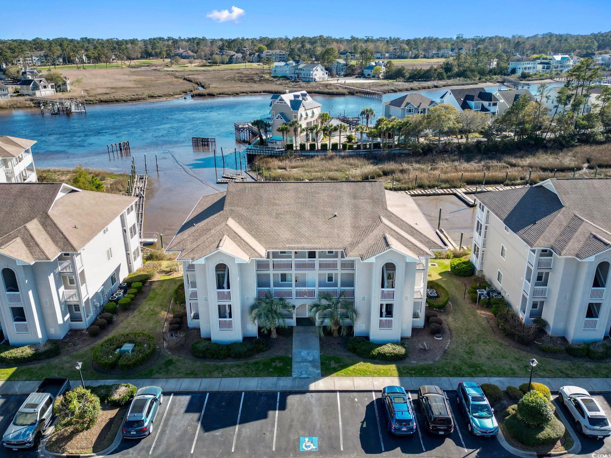 after pulling into this quiet golf community on the water, you walk into this fresh smelling, beautifully updated unit. you have a granite countertop with stainless steal appliances. as you walk in, you have a clear view of the waterway behind you. after a long day at the beach, come home and freshen up with an updated master bathroom. come relax on the back screened in porch to keep bugs away and watch boats go by as you unwind from a long day. this can make a great get away home for your family or a good investment for investors.