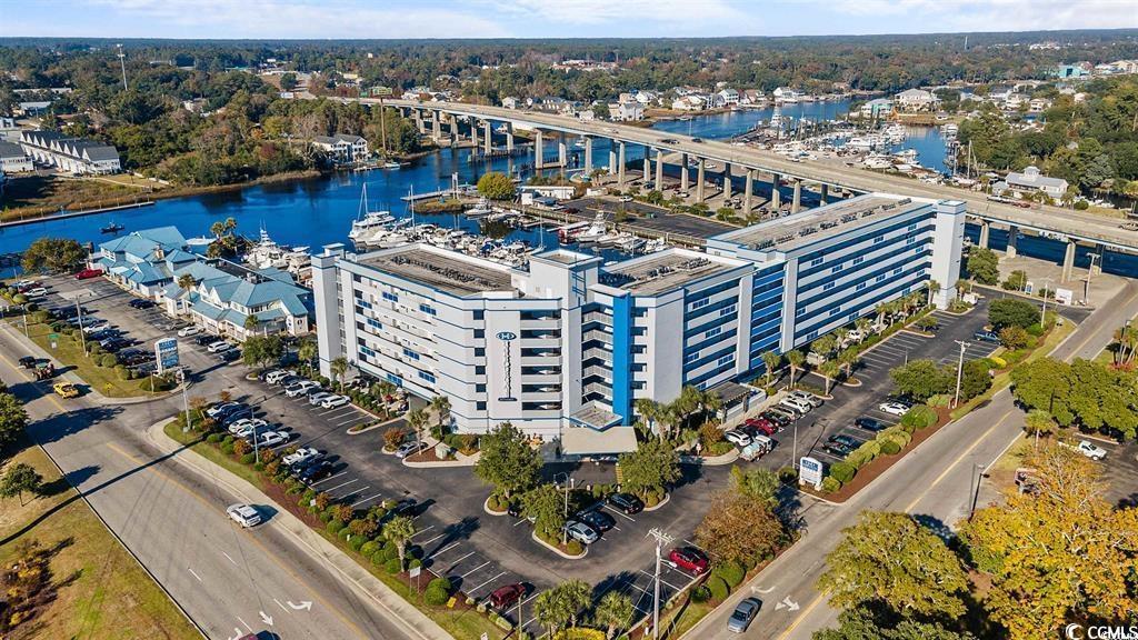 location, location, location!!! experience true coastal living in this exquisite 3 bed, 2 bath condo situated along the intercoastal waterway. fully furnished with luxury vinyl plank flooring throughout and tile in bathrooms, this condo offers both style and comfort. the kitchen boasts essential appliances including a stove, refrigerator, and dishwasher, along with ample cabinet and countertop space, making the chef of the family very happy. the covered balcony  enjoy the convenience of covered parking, onsite boat storage, and access to the community pool and hot tub. enjoy an evening cocktail or a morning cup of coffee on your spacious balcony, overlooking the waterway! nestled in a prime location, this condo puts you just minutes away from the vibrant attractions, shopping, and beaches of little river, cherry grove, and north myrtle beach. take advantage of the onsite marina, featuring the popular filets restaurant and a fabulous tiki bar with stunning views of the intercoastal waterway. don't miss out on the chance to live the coastal lifestyle you've always dreamed of. schedule your showing today!