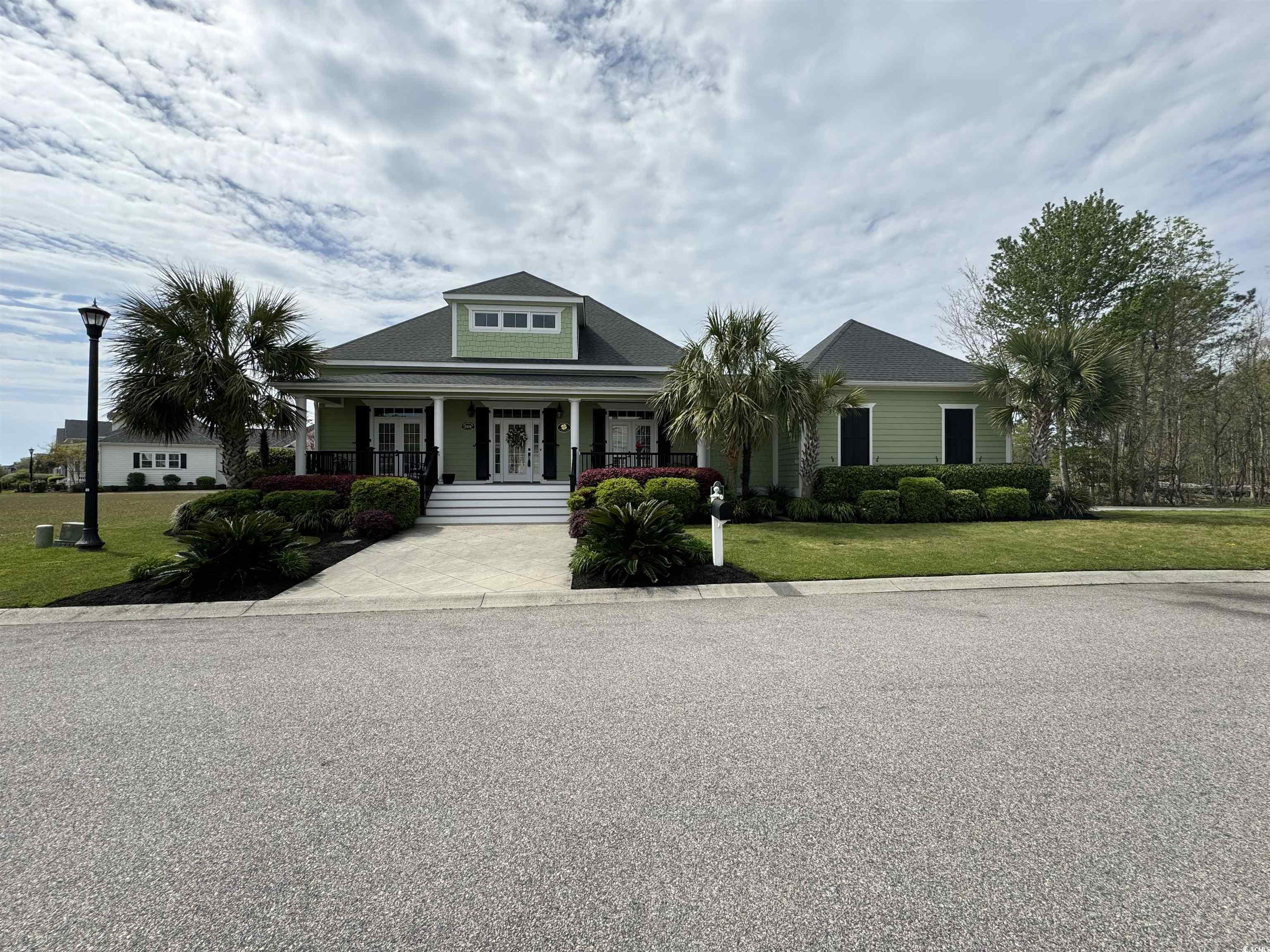 this beautiful home is located in charleston landing only 2 miles from the beach! get one of the fewer homes in charleston landing with a spacious lot. this home features a back patio, as well as, a closed in back porch. the closed in back porch features slide down windows for a cool carolina breeze! the landscape barrier has the backyard feeling like your are in a secluded area all while having the benefits of the neighborhood amenities. once you walk into the front door you have 2 masters on each side of the house with access from each bedroom onto the front porch. the kitchen features granite countertops, with all cabinets accessible for storage, and a spacious pantry. the downstairs laundry room/mud room is accessible from the garage. the upstairs has 2 bedrooms and a shared bathroom, and 2 separate storage areas. don't let the adjacent construction divert you. a greenway barrier will be put up to keep the privacy of each neighborhood! don't miss out on this charleston living in a great community!