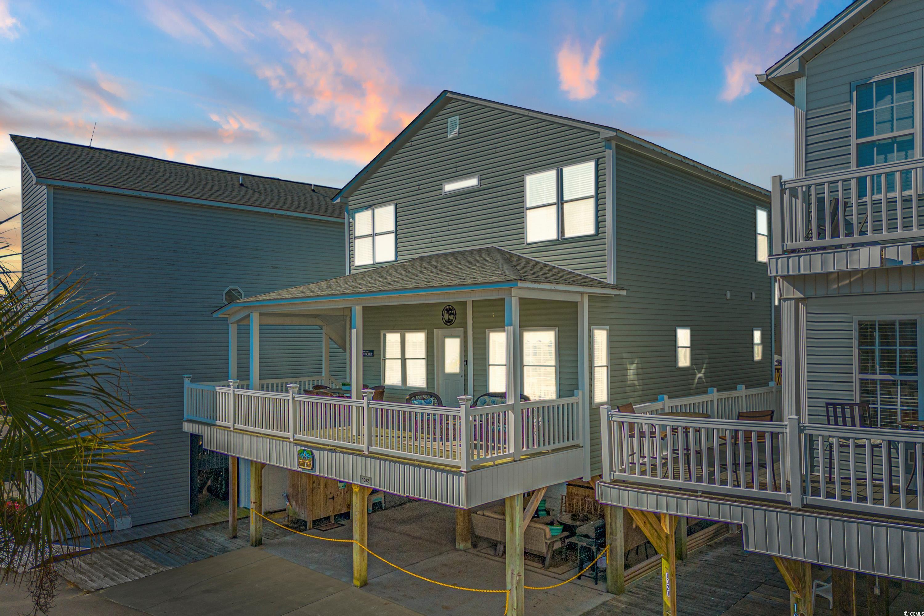 this 5-bedroom 3.5 bath raised beach house is located in the award winning ocean lakes family campground.  built in 2007 and recently updated to include lvp flooring throughout, granite counters, stainless steel appliances, new interior paint, covered steps, freshly painted decking, huge covered front porch, and great under house entertaining area with tv, conversational set, bar, fire pit, table and 4 chairs, bbq grill, and large storage building.  new hvac in 2020 and new water heater in 2023.   the main floor features the living room, open concept kitchen with island and 4 stools, dining area, 1/2 bath, 1st floor laundry, master bedroom with master bath.  upstairs has 4 additional bedrooms and 2 full bathrooms.  this property is fully furnished.