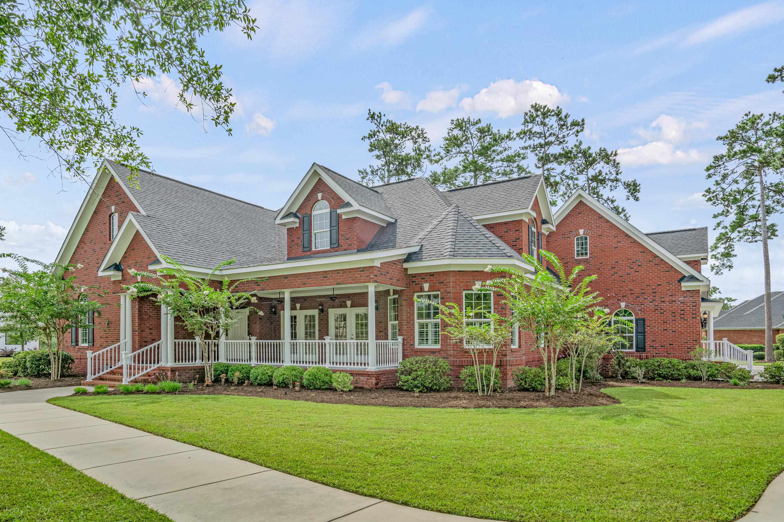 crafted with meticulous attention to detail, this custom-built residence boasts a blend of elegant hardwood floors, plush carpeting, refined crown molding, and intricate millwork, creating an atmosphere of sophistication and warmth. its open-concept layout, enhanced by a flood of natural light, cultivates a welcoming and cozy ambiance that invites relaxation and social gatherings alike. the kitchen, a culinary paradise, features sleek granite countertops, a stylish tiled backsplash, a versatile center island, ample cabinetry, and extensive counter space. complemented by state-of-the-art stainless steel appliances, including a glass range with both regular and convection cooking options, it's a space where cooking is a joy. the adjacent breakfast nook offers a charming spot for informal meals, adding to the home's allure. the ground floor hosts the primary suite, a sanctuary complete with a serene reading nook and a spacious custom closet. the ensuite bathroom indulges with dual vanities, a jetted tub, and a separate shower, encapsulating luxury and comfort. also on the first floor is a versatile room currently serving as a den, offering endless possibilities for use, including as an additional bedroom. ascending to the second level, two more bedrooms await, each with ample closet space and full private baths.  further enhancing this home's appeal is the guest quarters located above the three-car garage, featuring a living room/kitchenette, dining area, generous sized bedroom and full bath, providing ideal accommodation for guests or as a mother-in-law suite.  outdoor living is equally inviting with both front and rear covered porches, offering serene spaces for morning coffees or evening relaxation. set on a sprawling .65-acre lot, there's ample space for adding an outdoor kitchen or swimming pool, making it a haven for entertainment or tranquil solitude.  situated in the coveted gated community of creek harbour, this home enjoys access to premium amenities, including a clubhouse and pool just steps away, a private boat launch with access to the waccamaw river, a large dock, and boat storage. its prime location in the heart of prince creek is moments from the tpc golf course and the many attractions of low country living.   this residence is an embodiment of luxury, convenience, and lifestyle. a rare gem in a sought-after community; an opportunity not to be missed.