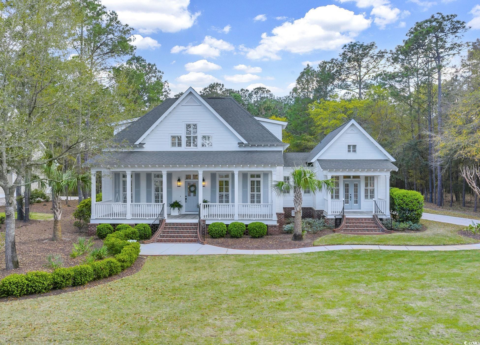 exquisite southern living style home located in the highly desirable pawleys island community of the reserve. upon arrival you are greeted by the large welcoming front porch perfect for an afternoon with friends or family. this incredibly well-maintained home is move in ready for the buyer looking for luxury in the low country. the detached carriage house can serve as a private guest oasis or the perfect home office. residents of the reserve enjoy access to litchfield by the sea, a gated beachfront community. the reserve is also home to a greg norman private golf course, as well as the safe harbor marina. memberships are available to purchase separately.  close to shopping and fine dining, pawleys island is just 70 miles to historic charleston, sc or 25 miles to the attractions ofmyrtle beach!