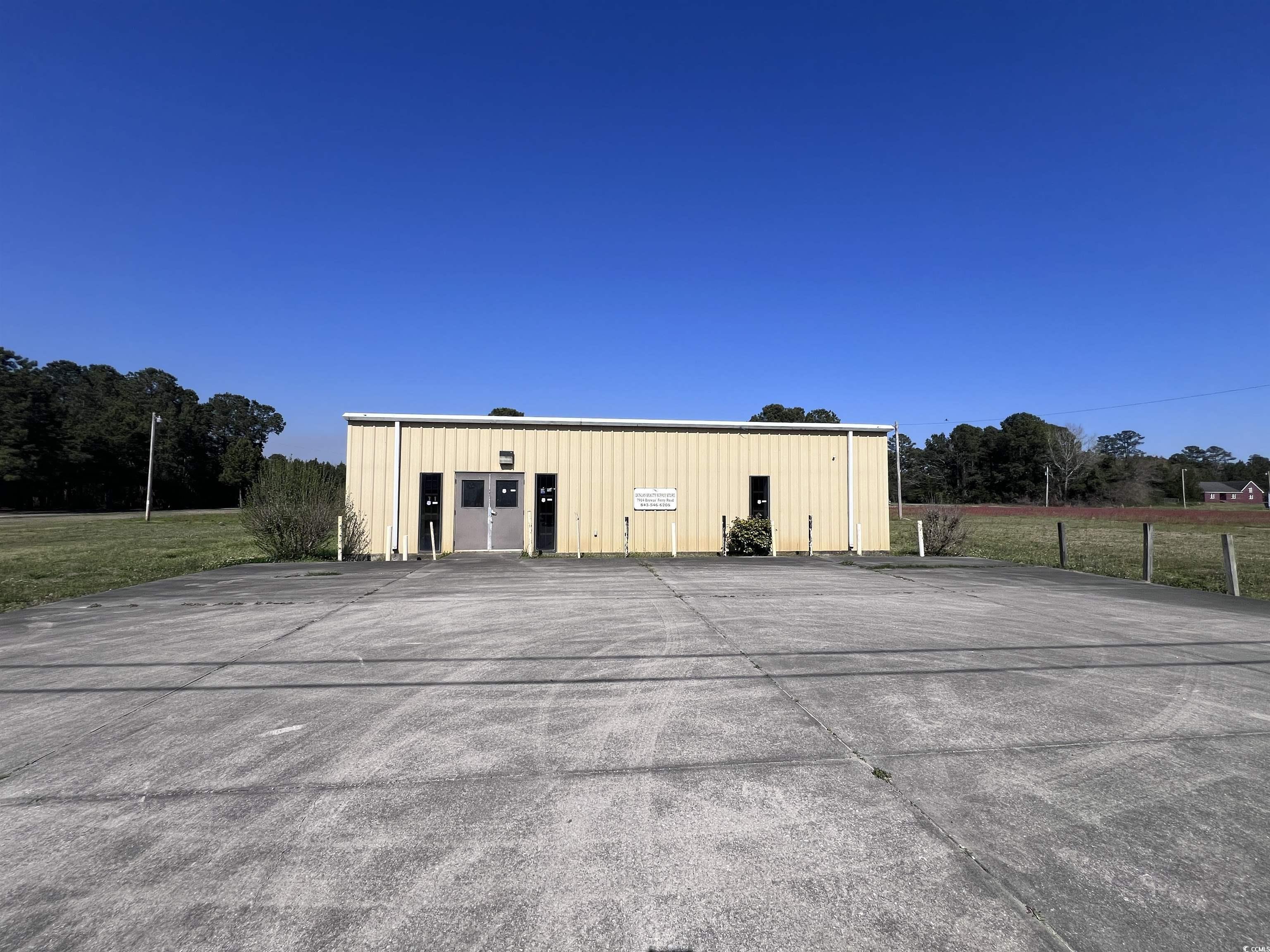 almost 3 acres commercial on hwy  51 in browns ferry with 2500 square foot metal building. this offering has 445 feet frontage. building is finished inside with hvac, drop ceiling and bath.