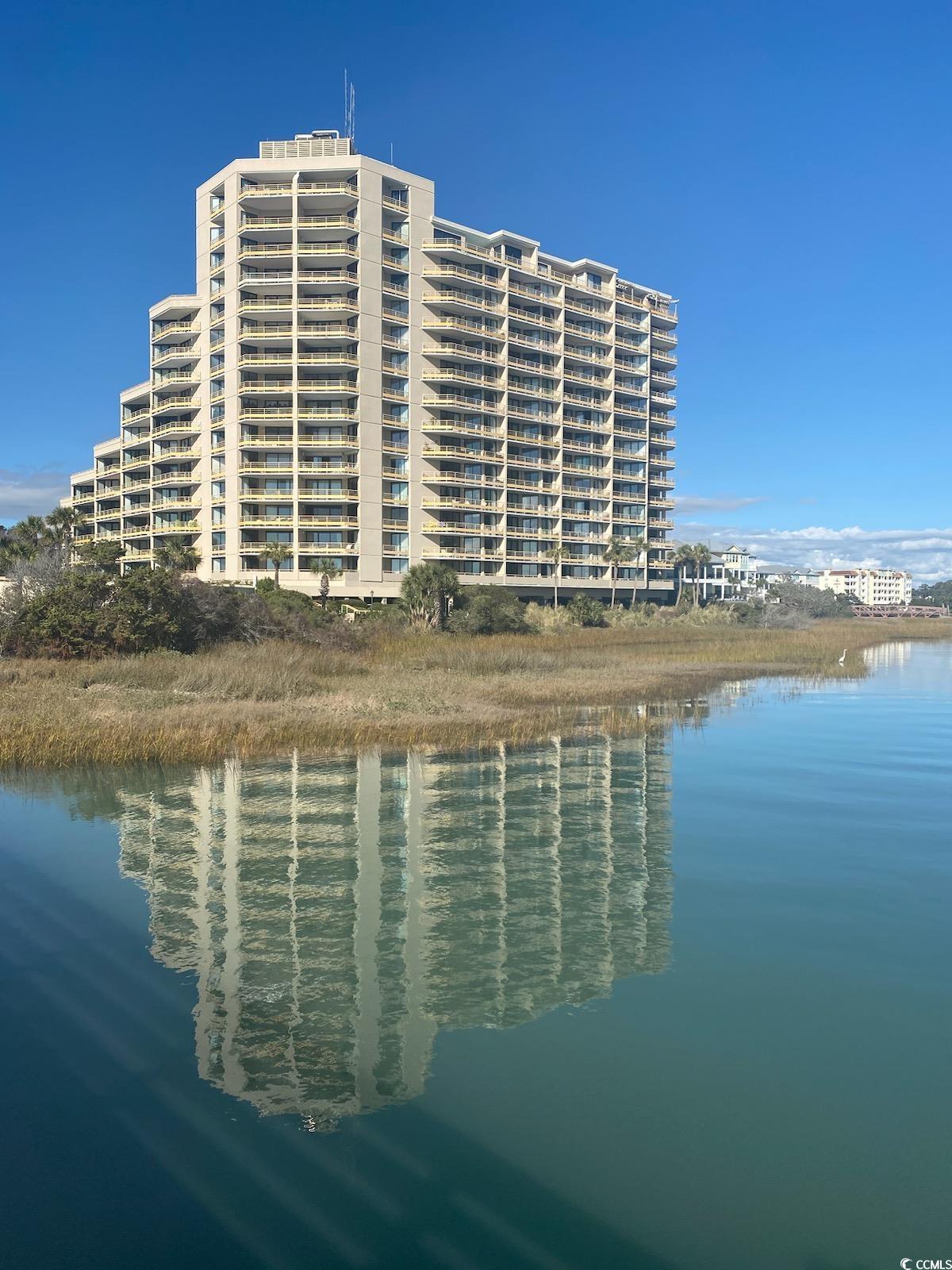 very convenient 1st floor location with views of the ocean, beach, the creek, beach club and pond. the balcony offers a southern exposure so you can enjoy wonderful afternoon sun in the winter and enjoy the beach sights while  listening to the fountain, watching the ducks and the turtles. ocean creek has 57-acres of park-like grounds. 24-hour gated security, tennis center, pickleball court, putting green, multiple outdoor pools, and an indoor pool with whirlpool. the community boasts a wonderful oceanfront beach club with a snack bar and grill open in season, sand volleyball court, outdoor pool, playground, lockers, and restrooms.  building insurance is assessed annually.   property is currently a vacation rental. all figs. & sq. ft. approximate.