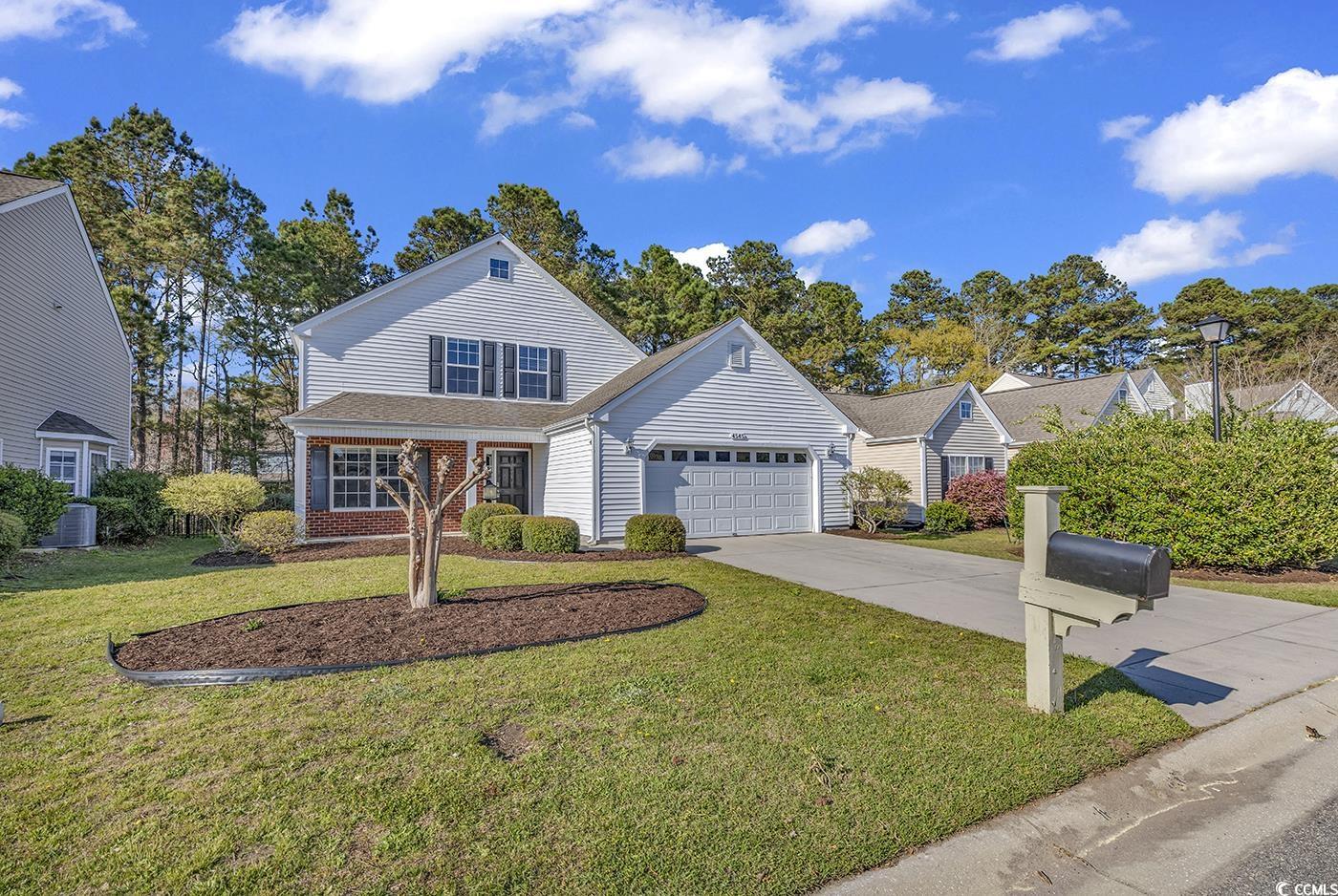 this 4br/3.5ba home in the popular farm at carolina forest backs to a wooded preserve area on a quiet street. all the bedrooms are spacious and this home features two master suites, one on the first floor and one on the second floor.   a nice size living room with ceiling fan, master bedroom with ensuite, eat-in kitchen, and half bath are located on the first floor.  the kitchen boasts plenty of bright white cabinetry.  a double sink, electric stove/oven, microwave, dishwasher and stainless-steel refrigerator allow for all the conveniences in a well-designed space.  additionally, the dining area is large, bright and has a great sliding glass door view of the private backyard and surrounding woods.   the first floor master bedroom is a very nice size and includes a walk-in closet.  the ensuite bath has a vanity, nice glass enclosed shower and storage closet.  rounding out the first floor space is a good sized half bath.    a surprise second master bedroom with an ensuite that includes a large soaking tub is a great resource for peace and relaxation. this second master bath also has a nice glass enclosed shower, and his/her closets. the second floor consists of two bedrooms with great natural light, ceiling fans and ample closet space.  the entire home features either tile or lvp flooring.  talk about curb appeal!  the brick and vinyl exterior are both practical and attractive. and the neat, manageable landscaping has been recently mulched and ready for the spring/summer bloom. also has an irrigation system. this home features an oversized two car garage with room for workspace, storage and a washer and dryer.   amenities include an 8000 square foot pool with clubhouse, a smaller pool, fitness room, basketball courts, playground, and more. the farms is a family-oriented community and is in the heart of a highly rated horry county, south carolina school district.  convenient location just minutes from beach, shopping, dining, golf, broadway at the beach, medical facilities, hospitals, myrtle beach international airport, highway 31, ocean bay elementary and middle schools, and so much more.