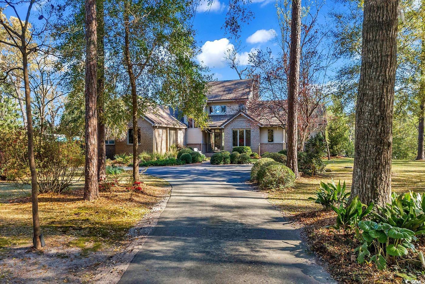 fabulous river view from one of the best bluffs overlooking the waccamaw river. custom built 2,801 sq ft home on private 2.2 acre homesite with 246 feet of river frontage. raised and floating docks. designed for beautiful views throughout the home! excellent bird habitat. owners suite on main floor featuring a private screened porch; fourth bedroom or private downstairs office with built-in desk and bookshelves; open upstairs office with built in desk, cabinets, & bookcases; a third built-in wood desk with river view in breakfast room; kitchen features dome lighting, inlaid mosaic tile, and lighted walk-in pantry; two upstairs bedrooms with river view and balcony; 2 large attic walk-in storage areas; wood-burning fireplace heats downstairs; solid red oak floors, energy efficient construction; 5g fiber optic cable; gerard roof with 50-year transferable guarantee; bennett steel building for recreation or storage with professionally painted mural; briggs & stratton whole house generator and 500-gal underground propane tank; 30-amp rv outlet. no hoa. this is an opportunity to own a beautiful home with landscaping abounding with mature trees, dogwoods, azaleas, and camellias located on a rare 42-foot-high scenic river bluff, above the 500 year flood level. all the tranquility of rural life centrally located off of hwy 90 only minutes from downtown conway, conway medical center, coastal carolina university for sports & cultural events, fully accessible to myrtle beach. eco-responsible irrigation system uses river water. oversized garage with sink, work benches, and additional lighting. paved loop driveway provides ample parking. too many features to list here, so request additional information. schedule your showing today! sellers are providing a 1-year home warranty. ask for details. square footage and all measurements are approximate and not guaranteed. buyers are responsible for verification.