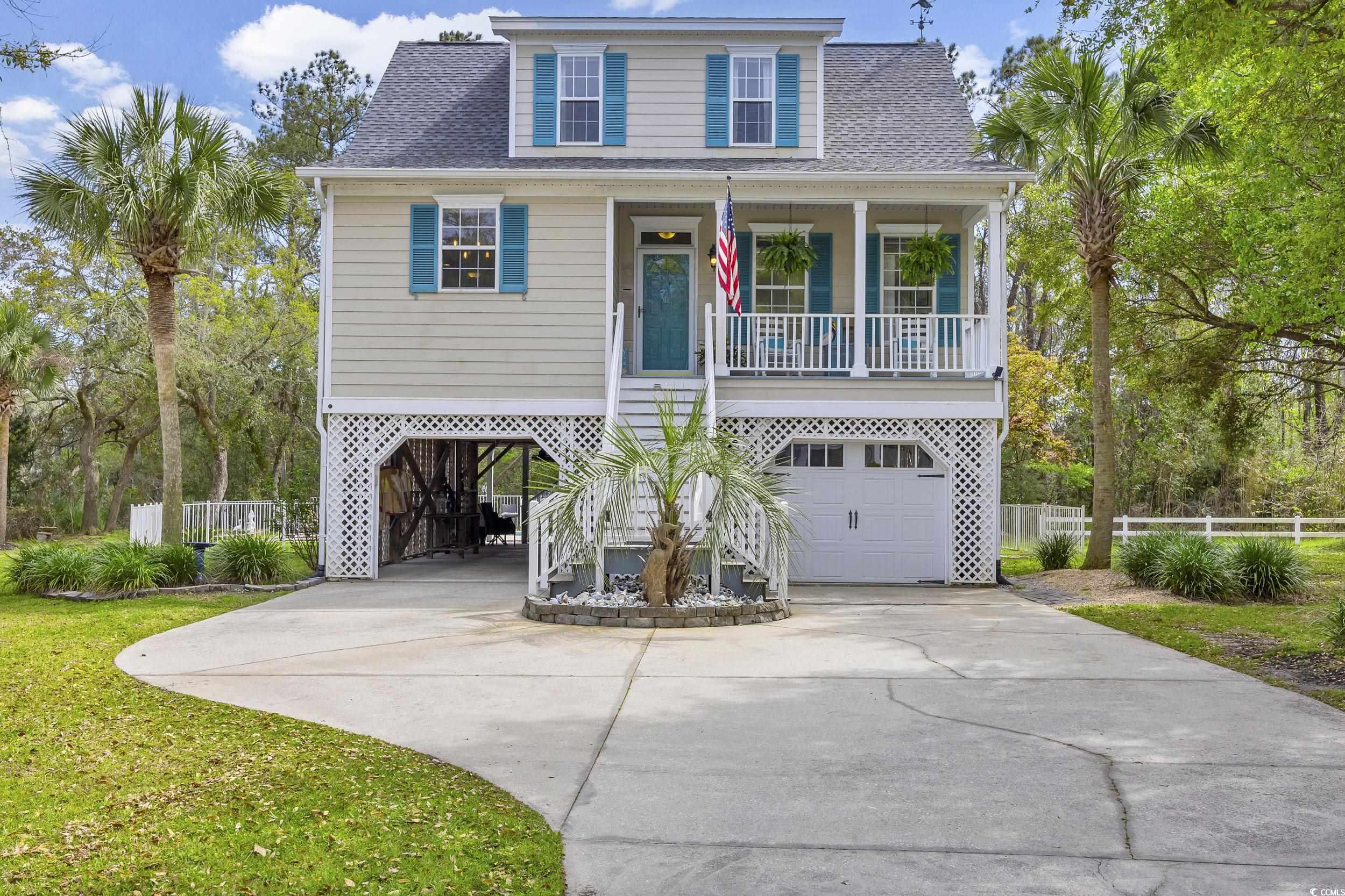 welcome to coastal comfort at marsh point in pawleys island!   escape to the laid-back charm of this delightful raised beach style home, nestled in the serene marsh point community of pawleys island. offering 3 bedrooms, 2 and a half bathrooms, and parking for up to 4 cars, this home embodies the relaxed coastal lifestyle you've been dreaming of. step inside and feel instantly at ease as you're greeted by the warm ambiance of the first level. crown molding adds a touch of character to the inviting living spaces, while the foyer welcomes you with pristine pine hardwood flooring. cozy up by the gas fireplace in the living room or step out onto the expansive back deck to soak in the tranquil marsh views. the spacious kitchen is a chef's delight, featuring solid granite countertops, subway tile backsplash, and stainless-steel appliances for easy meal preparation. gather with loved ones in the adjacent dining area, where a soothing ceiling fan overhead sets the perfect atmosphere for relaxed dinners and lively conversations. retreat to the primary bedroom suite on the first level, offering double walk-in closets and a private bath with quartz countertops and a walk-in shower. upstairs, two additional bedrooms provide comfortable accommodations for family or guests, each boasting unique coastal touches like sliding barn closet doors. step outside to your own private oasis, where a fenced backyard awaits with a refreshing saltwater pool, ranging from a shallow 3 feet to a relaxing 8 feet deep. perfect for cooling off on hot summer days or simply unwinding in the coastal breeze. additional features include a versatile "studio" room underneath the home, ideal for hobbies or storage, as well as an outdoor pool bath with a convenient shower for rinsing off after a day of fun in the sun. embrace the laid-back lifestyle of marsh point, where a community dock offers opportunities for crabbing and kayaking along the tranquil marsh shores. with its low traffic and welcoming atmosphere, this hidden gem provides the perfect retreat from the hustle and bustle of everyday life. don't miss your chance to experience coastal living at its finest—schedule your tour today and make this coastal retreat your new home!