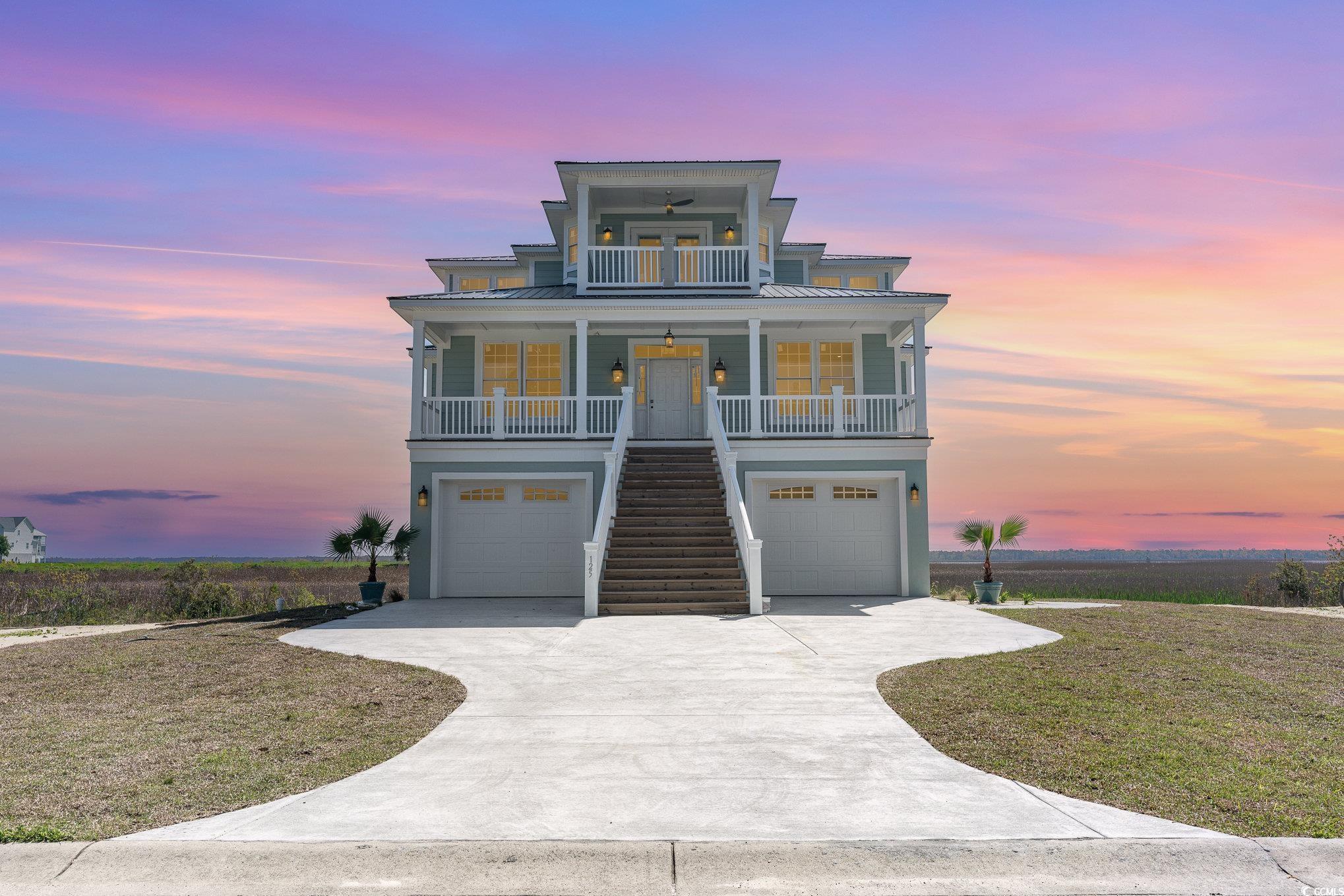 nestled within the serene beauty of georgetown county, south carolina, 125 oak bay rd stands as a beacon of opulence, offering an unparalleled coastal living experience. this magnificent raised beach home, situated on the marshlands, presents an idyllic retreat that perfectly harmonizes with its natural surroundings while exuding sophistication and elegance at every turn. from the moment you step inside, you are greeted by sweeping panoramic views of the marshlands that stretch as far as the eye can see. this home boasts an unobstructed vista that will forever remain untouched, providing a sense of serenity and privacy that is truly unmatched embodying the essence of lowcountry living, the exterior of the residence showcases classic architectural elements, including a raised foundation, expansive porches, and charm. the design seamlessly integrates with the natural landscape, creating a harmonious blend of beauty and functionality. step through the grand entrance and into a world of luxury and refinement. natural real hardwoods adorn the floors throughout, an elevator that reaches all 3 floors for the ultimate convenience, pocket doors, and complemented by exquisite crown molding that adds a touch of regal elegance to every room. the spacious layout encompasses six bedrooms and six full bathrooms, providing ample space for family and guests to indulge in comfort and privacy. the primary suite is a sanctuary of tranquility and relaxation, boasting breathtaking views of the marshlands from its private balcony. with its spacious layout,  and spa-like ensuite bathroom, complete with walk-in shower, it offers the perfect retreat after a long day of coastal adventures. residents of 125 oak bay rd enjoy access to an array of resort-style amenities, including a community dock and pool. spend lazy afternoons lounging by the poolside, soaking up the warm south carolina sun, or embark on a leisurely boat ride along the pristine waterways, immersing yourself in the natural beauty of the surrounding marshlands ideally situated in georgetown county, this luxury residence offers convenient access to a host of upscale amenities and attractions. with famous myrtle beach an hour to your north, and picturesque charleston one hour south, you're truly encompassed in beauty from all angles. from world-class golf courses and fine dining establishments to boutique shops and cultural landmarks, residents enjoy a lifestyle defined by luxury and leisure. 125 oak bay rd represents the epitome of lowcountry living, where luxury meets natural splendor in perfect harmony. with its unrivaled marsh views, lavish amenities, and exquisite craftsmanship throughout, this raised beach home offers a rare opportunity to indulge in the coastal lifestyle of your dreams. experience the height of sophistication and tranquility in this magnificent residence, where every day is a celebration of the beauty and serenity of the south carolina coast. call today to schedule a private tour, or with any questions!