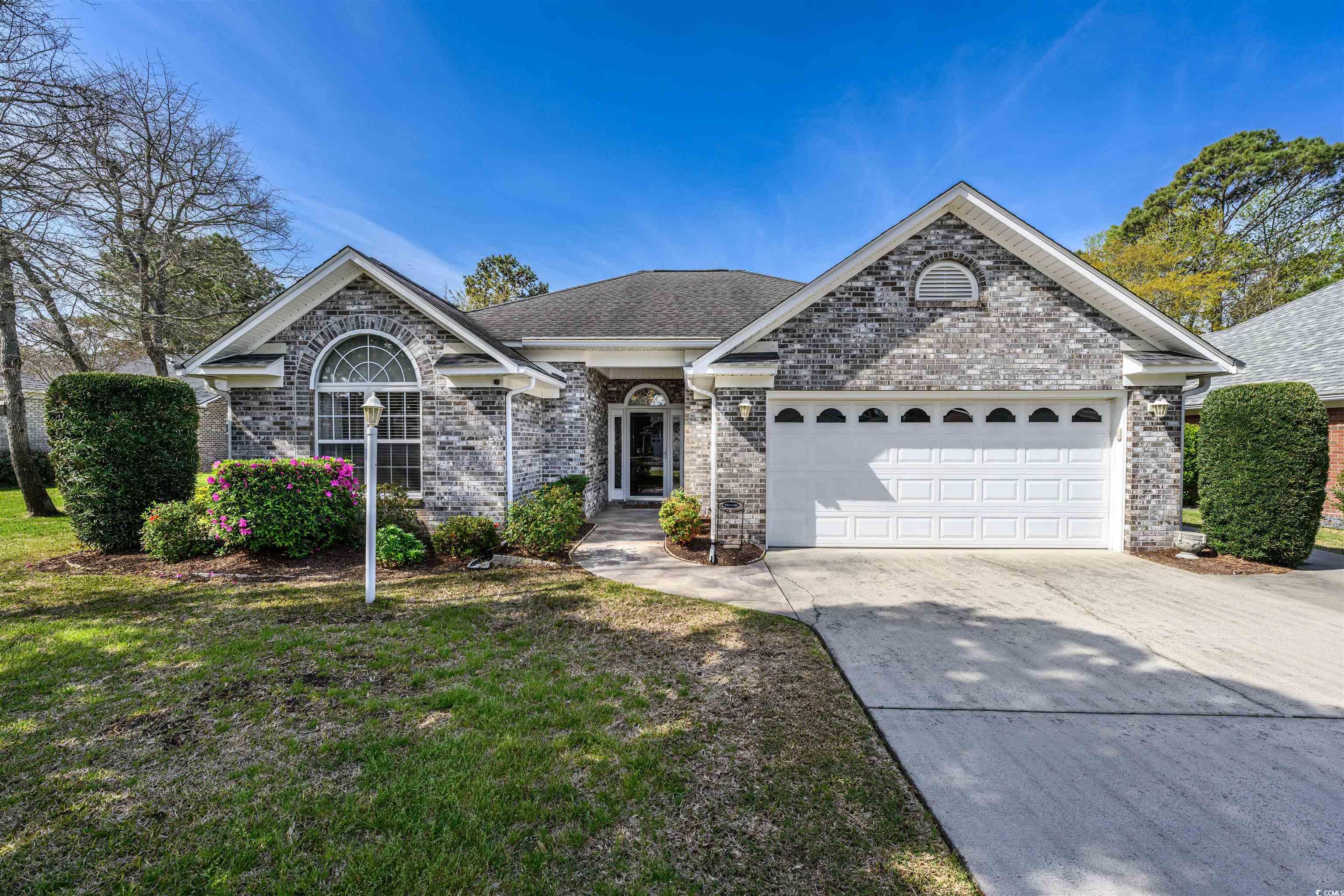 this wonderful all brick 3 bedroom, 2 bath home is located in the prestigious tilghman forest community. this beautifully landscaped home is only a golf cart ride to the ocean, churches, schools, shopping and more! one of the home's best features is the spacious and bright sun filled carolina room that adjoins the main livingroom. the kitchen boasts granite countertops and lots of cabinets for storage. the 2 bathrooms have been updated too. enjoy the communities large outdoor pool and clubhouse and very low hoa fees! you will love living in this quiet and peaceful community!