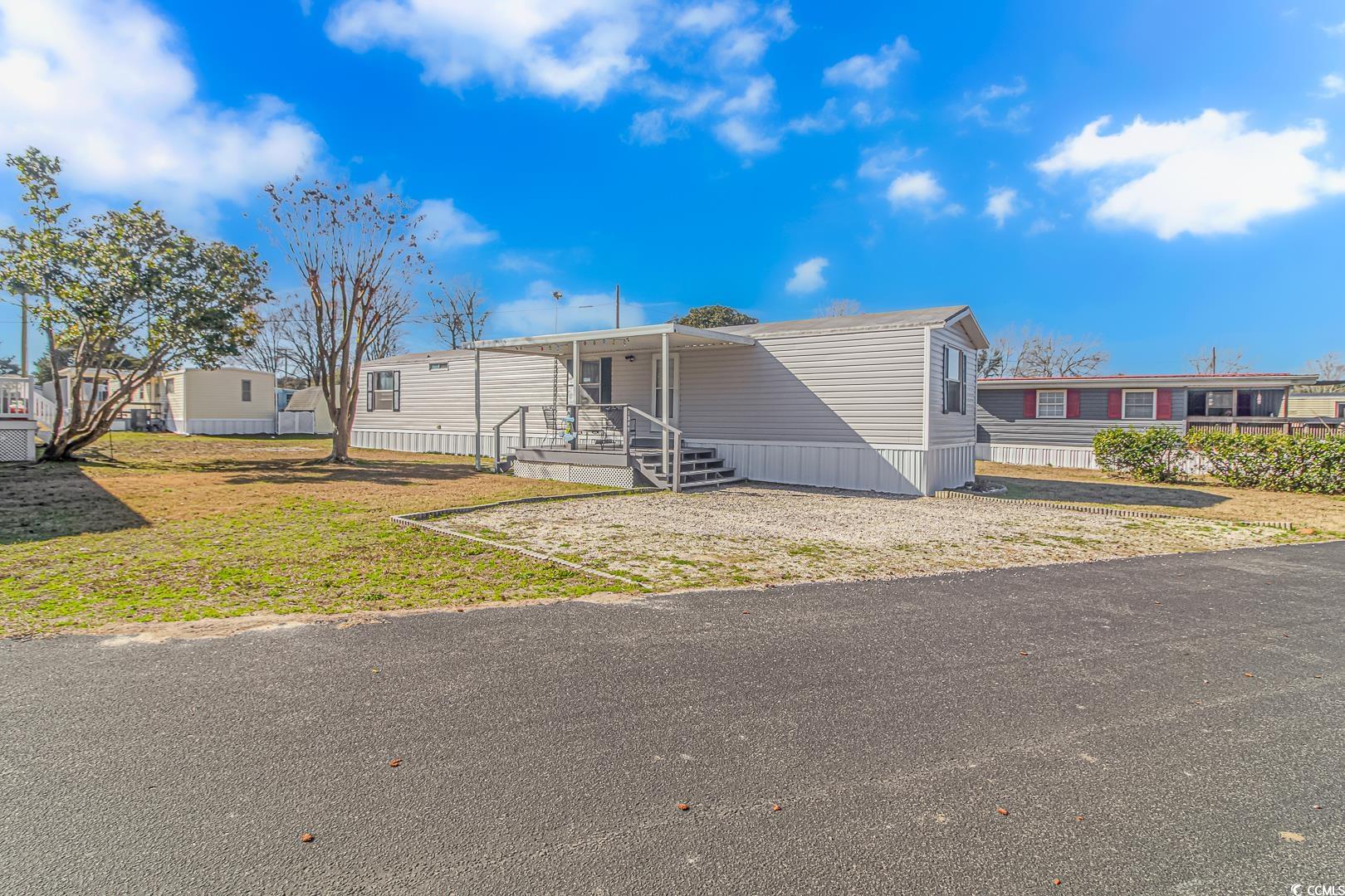 if you're looking for your own place by the beach, just a short golf cart ride to north myrtle beach, here it is!!! this property is located in a waterway community and is just a very short golf cart ride to the beach, as well as shopping, multiple restaurants and bars, and more. conveniently located near the ocean drive section of north myrtle, you can't get better location than this for the money. property features two spacious bedrooms, two baths, and has been updated with new vinyl siding, skirting and the roof has recently been recoated. living area and kitchen are also large and have plenty of room for entertaining. the community is golf cart and boat friendly, so bring your toys and have a permanent place at the beach. there is also an attached storage shed for your beach equipment and other items. this one has been priced to sell, especially for the size and location. don't wait, come see this one today! easy to be seen on short notice!!!