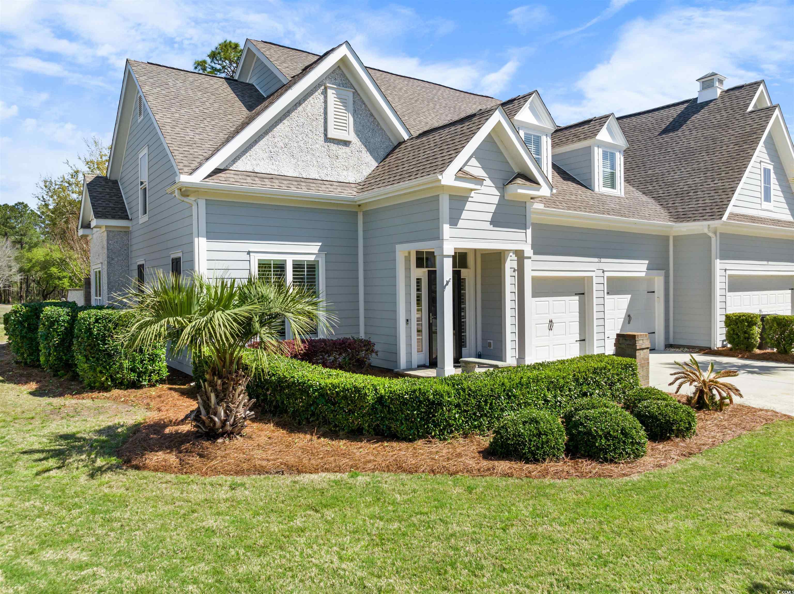 50 golf club circle offers the best in coastal low country living in the prestigous community of the reserve at pawleys island sc. the design of the villa provides a delightful coastal lifestyle with an open floor plan including a gracious primary suite on the same entry level as main living areas. the kitchen, dining and living area with cathedral ceiling all flow together to a large screen porch and patio with gorgeous views of magnificent oak tree and pond. the first floor level living is complemented by a formal foyer, den/office, powder room, large laundry room and a spacious two car garage. just up the stairs finds two addition spacious bedrooms each with private bath, den/media room, and lots of storage! home owners at the reserve enjoy many terrific amenities including, security and gated access, walking/biking paths and the wonderful ocean side fun of litchfield by the sea with private beach access and beach club, crabbing and fishing docks, tennis, walking trails/bike paths galore! other amenities available to homeowners in the area include membership at the reserve golf club and/or the harbor club marina on the icw/waccamaw river. experience the exuberant pawleys coastal life style of catching the sunrise with coffee on the beautiful beach of litchfield by the sea and later the same day, watching the sun set over the waccamaw river.... all within easy golf cart ride! the reserve is located in the beautiful low country of pawleys island sc with all the fun of myrtle beach just 20 miles north and just 60 miles south the great shopping, dining, and entertainment of historic charleston sc.