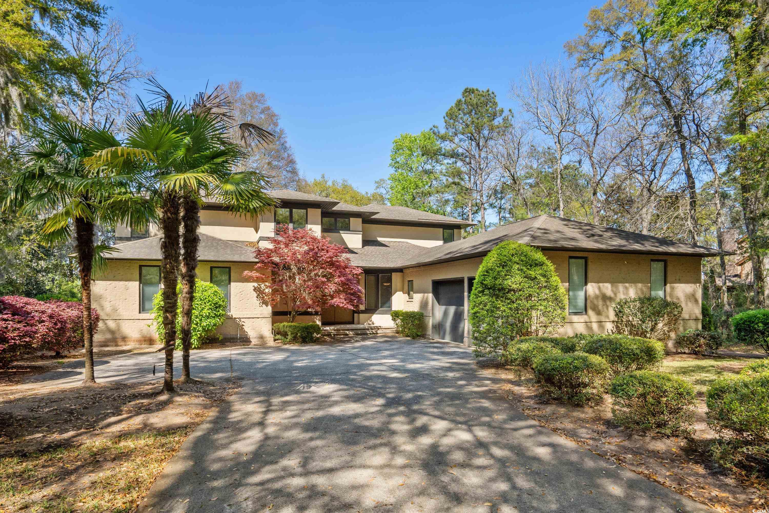 discover the epitome of coastal living in this distinctive property located in the prestigious pawleys plantation, a gated community celebrated for its jack nicklaus signature golf course and serene marsh vistas. this home stands out with its unique architectural features, starting with a solitary bedroom on the ground floor, complemented by mainly tile flooring and cozy carpeting in the bedroom for that touch of warmth. the kitchen, a chef's delight, boasts maple cabinets and granite countertops, seamlessly blending functionality with style.  high beam ceilings add an unmistakable character to the space, infusing it with a contemporary aura that is both inviting and sophisticated. despite its spacious layout, the home offers two very small rooms on the lower level; one currently serves as a compact bedroom suitable only for storage due to the absence of a closet, while the other functions as a small office. remarkably, all bedrooms are generously sized, each with the potential to serve as a master bedroom, providing ample space for relaxation and privacy.  living in pawleys plantation means more than just enjoying a beautiful home; it's about embracing a lifestyle. with its proximity to the ocean, residents can enjoy the soothing sounds of the waves at night, a constant reminder of the tranquil setting. the community itself is a haven for golf enthusiasts and those seeking an active lifestyle, with a newly renovated golf course, outdoor kitchens for entertaining, and a landscape that invites nature lovers to explore and relax.  whether you're sipping coffee while watching the sunrise over the houses on the island or enjoying the golf course and marsh views from your florida room, this property promises a blend of luxury, comfort, and scenic beauty. it's more than a home; it's a retreat for those who appreciate the finer aspects of coastal living.