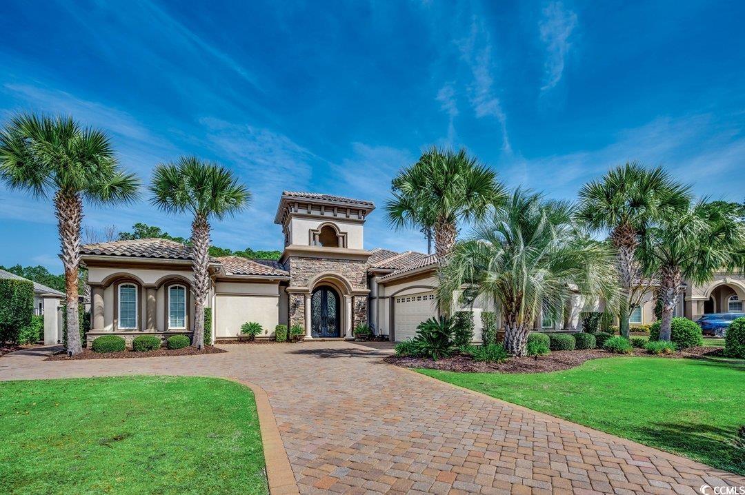 welcome to luxury living on the prestigious resort course at grande dunes! this remarkable custom home sits on one of the largest lots with 1.1 acres overlooking the 5th fairway and green of the grande dunes resort golf course and a serene pond. exceptional quality and attention to detail is found in this stunning 5 bedroom, 5 1/2 bath home. perfect for multi-generational living or hosting guests, this residence features a well-appointed mother-in-law suite or guest house, along with a game room, exercise room, and office. entertain with ease in the outdoor oasis, complete with a sparkling pool, outdoor kitchen /bar area and covered sitting space. the heart of the home is the gourmet kitchen, where custom cabinetry, a double oven, gas stove, and expansive island await the culinary enthusiast. enjoy casual meals in the charming breakfast nook, overlooking the courtyard outdoor living space including a pool area, bar, kitchen and outdoor fireplace. retreat to the expansive primary suite, offering a tranquil sitting area and a lavish  bath with separate his and hers sides, a spacious garden tub, and a tiled walk-in shower. off of the primary suite, you will find the office with a cozy fireplace.with two additional bedrooms on the main level and a private bedroom suite upstairs boasting its own bathroom and sitting area, this home offers unparalleled comfort and space for easy living. escape to your own personal oasis and enjoy the luxury of two distinct outdoor experiences. choose to unwind in a beautiful isolated courtyard, where a beautiful pool, hot tub and fireplace await. enjoy the outdoor kitchen with a bar/island, while guests mingle in the spacious entertaining area. in the back yard you can relax under the lanai and enjoy the ambiance of an impressive modern fire table. while drinking your morning coffee, take in the breathtaking views of your expansive lot—the largest in grande dunes—featuring a serene water fountain, lush garden, and panoramic vista of the 5th fairway and green of the grande dunes resort golf course. whether you seek relaxation or entertainment, these outdoor spaces offer luxury living at its finest. conveniently located towards the front of the community, this home offers the perfect location for the grande dunes lifestyle. this property is located in the highly desired  coastal community, grande dunes and features amenities including oceanfront pools, restaurants, meeting rooms and activities. the grande dunes has two 18 hole golf courses, several on-site restaurants, a deep water marina, hiking and biking trails, parking at the beach club, access to the beach and umbrella with chair rentals for the perfect relaxing day at the beach.