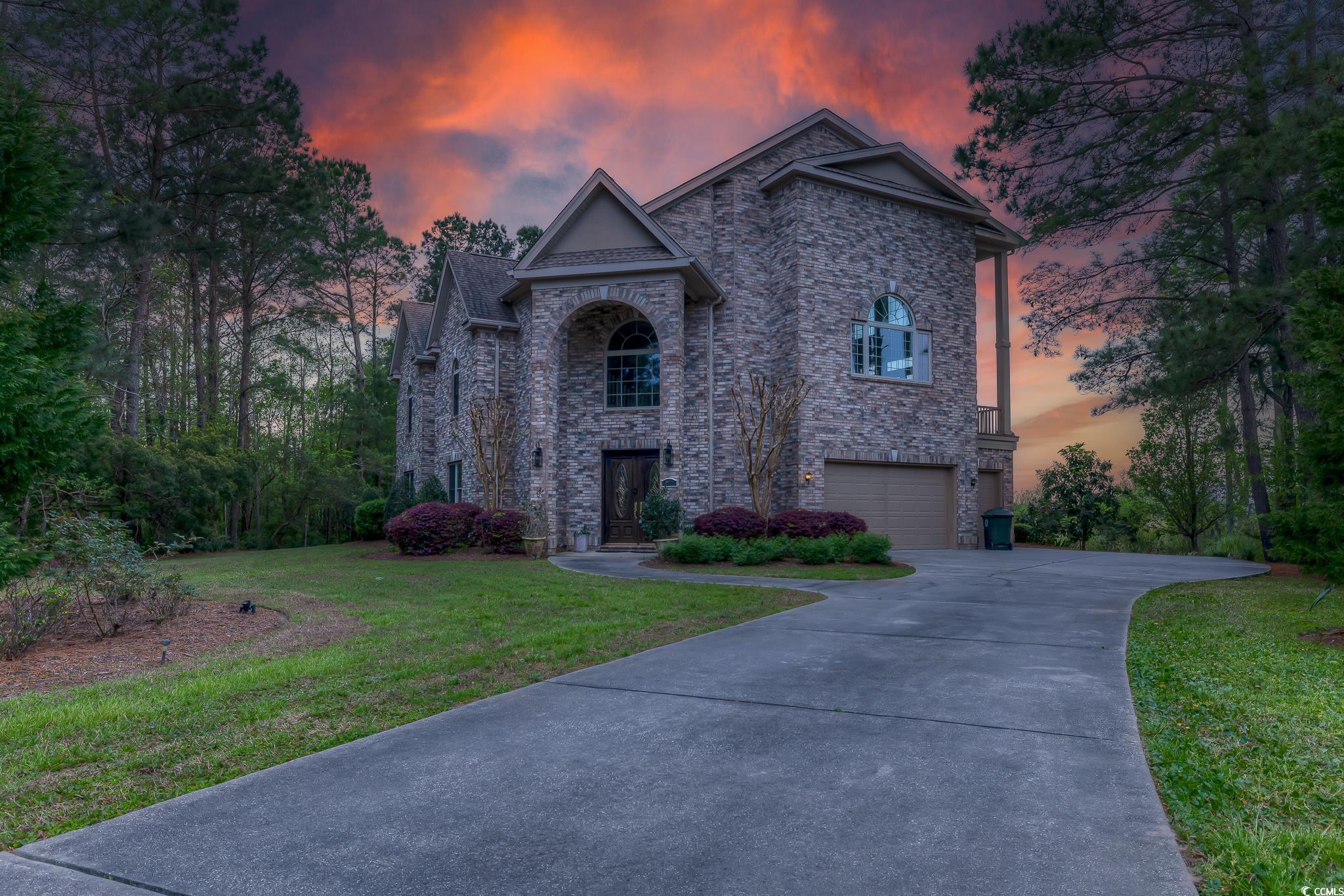 introducing 292 portrush loop, a masterpiece of custom construction in the prestigious heritage plantation, boasting breathtaking marsh and waccamaw river views, alongside the heritage marina. this secluded 5-bedroom residence is a testament to luxury and exclusivity. upon entering, the grandeur of a multi-level foyer with an exquisite handcrafted staircase welcomes you, setting the stage for a home that's far from ordinary.  crafted with attention to detail, the home is adorned with sophisticated features such as crown molding, architectural archways, tray ceilings, hardwood floors, and more. its grand living space is illuminated by a double-sided fireplace and french doors that open to a vast deck, offering an ideal setting for relaxation and entertainment. the gourmet kitchen is a chef’s delight, with custom cherry cabinets, a viking cooktop nestled within a large island, and granite countertops.  the dining room, with its panoramic waterway views, can comfortably accommodate 12 guests, enhancing the home’s allure for hosting gatherings. the master suite is a private haven with a double-sided fireplace, a secluded seating area, and a deck for peaceful moments. its luxurious bath includes dual vanities, a walk-in shower, and a jacuzzi, all overlooking the serene river.  additional highlights include a media room, a second master suite for ultimate privacy, three more bedrooms each with their own bathrooms, and a comprehensive mother-in-law suite. the property is designed for comfort and ease, with 10-foot ceilings, an elevator servicing all floors, and an oversized three-car garage.  set within a gated community, this home provides access to the marina, clubhouse, pool, tennis courts, and playground, ensuring a lifestyle filled with leisure and enjoyment. with its majestic views, elegant interiors, and unparalleled amenities, 292 portrush loop is not just a home—it's a sanctuary meant to be cherished for generations.