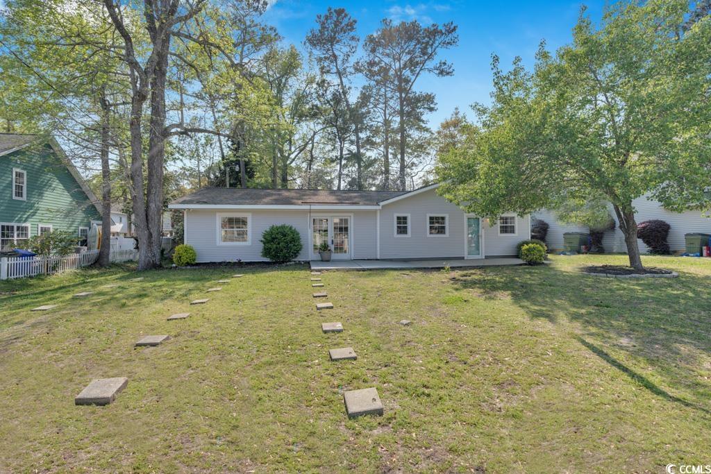 make this adorable and unique four bedroom, two bath beach home your very own!  all on ground level with a split floor plan and great outdoor space. located a half mile to the beach and to all that surfside beach has to offer.   this is a concrete-block home and is built to last! fresh paint and brand new lvp flooring installed throughout with two entrances in the front offering so much potential!   this home can be your primary or your beach getaway!