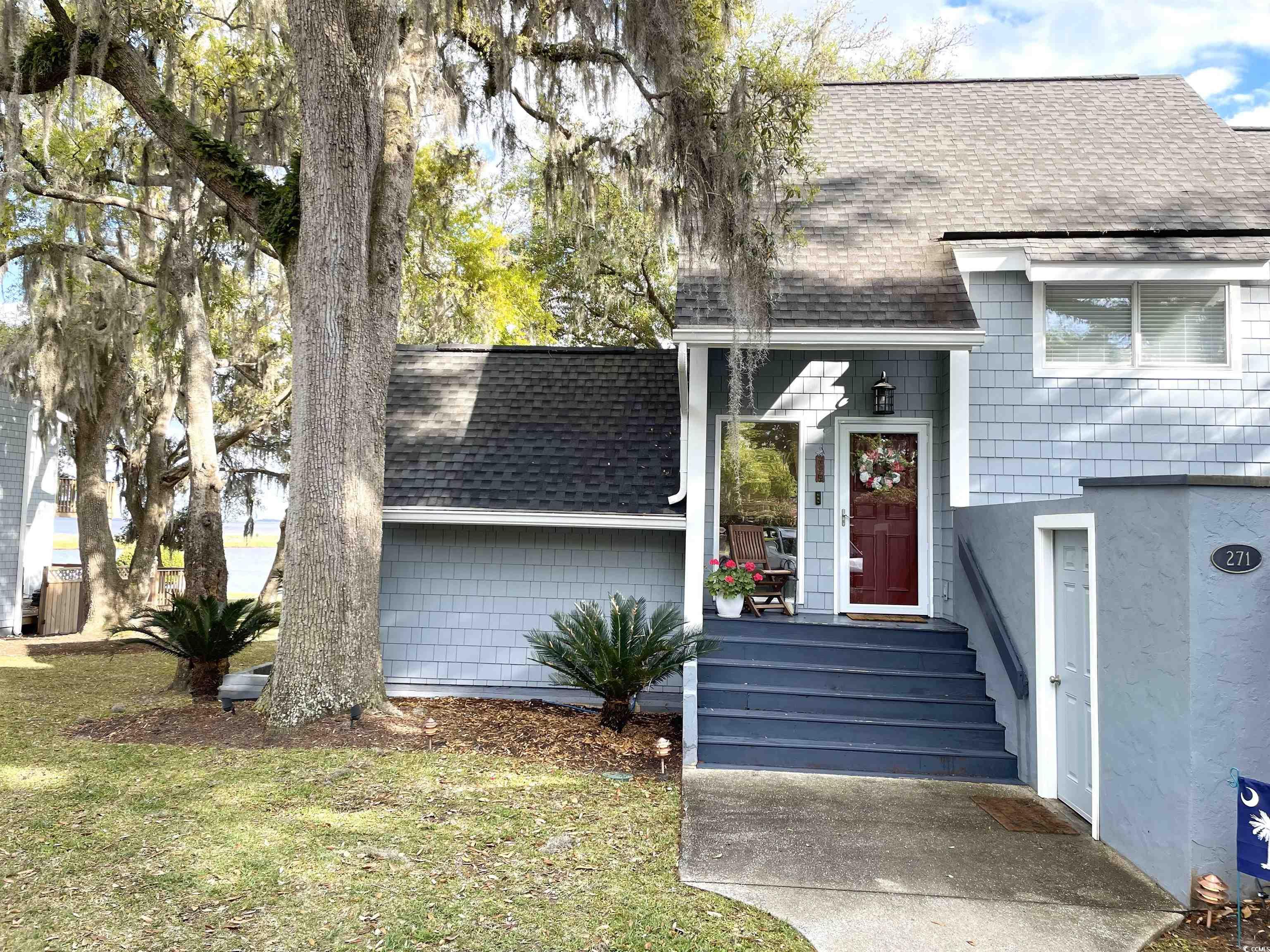 this renovated corner unit, nestled in the coveted regime iii of the belle isle yacht club offers views of johnstone lake and winyah bay.   this 3-bedroom, 2.5-bathroom waterfront villa has been meticulously updated to provide a modern yet cozy ambiance. upon entering, you're greeted by a newly installed kitchen adorned with granite countertops, sleek stainless steel appliances, and modern cabinets. hardwood floors extend through the kitchen and dining area and the villa has been freshly painted as well. carolina room and master bedroom are the perfect place to relax and enjoy stunning unobstructed sunrise views and mother nature's beauty. belle isle is blessed with beautiful live oaks and the azaleas   are in full bloom. as part of the belle isle yacht club community, residents have access to an an array of amenities including a marina, two in-ground pools, tennis courts, two clubhouses, and a private beach house nestled in pawleys island.  additionally, recent upgrades such as durable concrete siding (hardie board) and fresh paint on all units, along with re-roofing, ensure the longevity of appeal of the complex. this villa presents a move-in-ready dream home opportunity. embrace the vibrant, amenity-rich community and immerse yourself in the allure of coastal living at its finest.