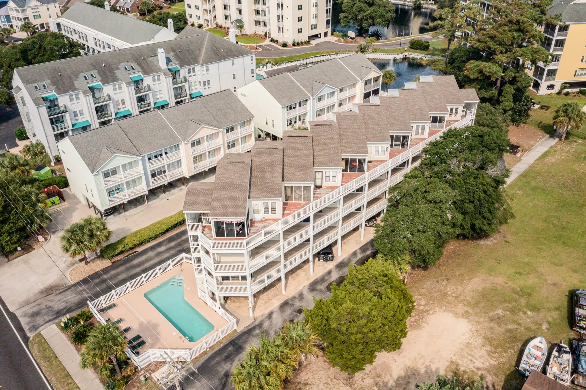 turn-key investment opportunity, walking distance to the beach, fully updated and fully furnished. this vibrant coastal 2-bedroom, 2-bathroom condo is just one block from the ocean and two blocks from main street where you can enjoy live music, shopping, dining and shagging. the condo has been beautifully updated in modern coastal fashion giving a bright and fresh feel. the kitchen has been updated with quartz countertops, bright cabinets, stainless steel appliances, and has everything you need to prepare a dining experience. the living and dining areas have plenty of seating for guests and the living room has a new queen sleeper sofa. step into the cozy bedrooms, each outfitted with new beds and mattresses, promising restful nights and rejuvenating mornings. both bedrooms have ensuite bathrooms with tub/shower combos and both share a balcony where you can enjoy an evening cocktail. convenience is paramount with a washer/dryer combo conveniently located within the unit. plus, the complex amenities include a refreshing pool, perfect for cooling off on warm coastal afternoons. don't miss your opportunity to experience coastal living at its finest – schedule your private showing today and make this turnkey paradise your own coastal retreat or investment property.