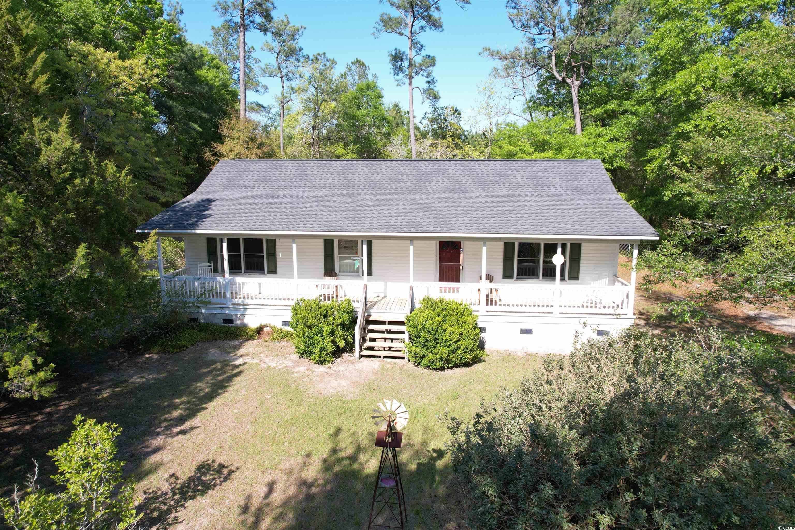 charming 3 bedroom, 2 bathroom ranch style home located on francis marion drive, across from black river. the home sits on 0.78 acres and is approximately 1,372 square feet. with an open concept, the front door opens to a living area, which is adjacent to the kitchen. the kitchen offers a large island across from the dining area. the primary bedroom offers a large space and has an en-suite bathroom with a double vanity and water closet. the remaining 2 bedrooms share a hall bath, and each are spacious in size. the yard is fenced in and offers a concrete slab for parking or entertaining. it also has a shed that measures 20x20 and is perfect for storing all of your items or for a man cave or she-shed! the home received a new hvac in 2016 and a new roof in 2018. this home is approximately 3 miles from browns ferry landing!
