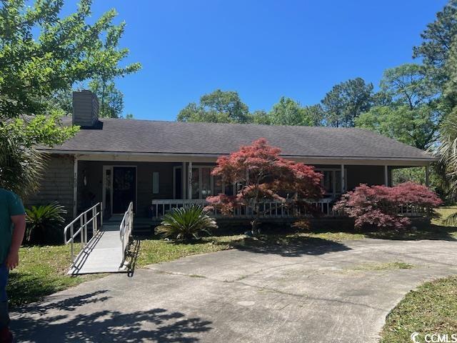 welcome to georgetown, sc.  this is a rare opportunity to purchase in the beautiful belle isle forrest subdivision.  this country setting is minutes from mt. pleasant, myrtle beach and our beautiful waterfront city of georgetown and all of its amenities.  the open floor plan comes complete with spacious rooms and endless possibilities.  this unique home is located at the end of a cul-de sac and backs up to south island road.  a jacuzzi is included in the sale.  the property has a detached two car garage.  there is lots of room to grow on this lot.  the property is minutes from the south island ferry, with access to the intracoastal waterway. there are many trees and flowers planted throughout this property including japanese maples, pecan, peach, pear, miniture palms, palmetto palms, sega palms, oak, as well as grape vines, gladiolas, azeleas clemente and kiwi. too many extras to list.this is the perfect prospect for an investor or family wanting a home to remodel.  the house is being sold "as is" and pricing is reflective of that.