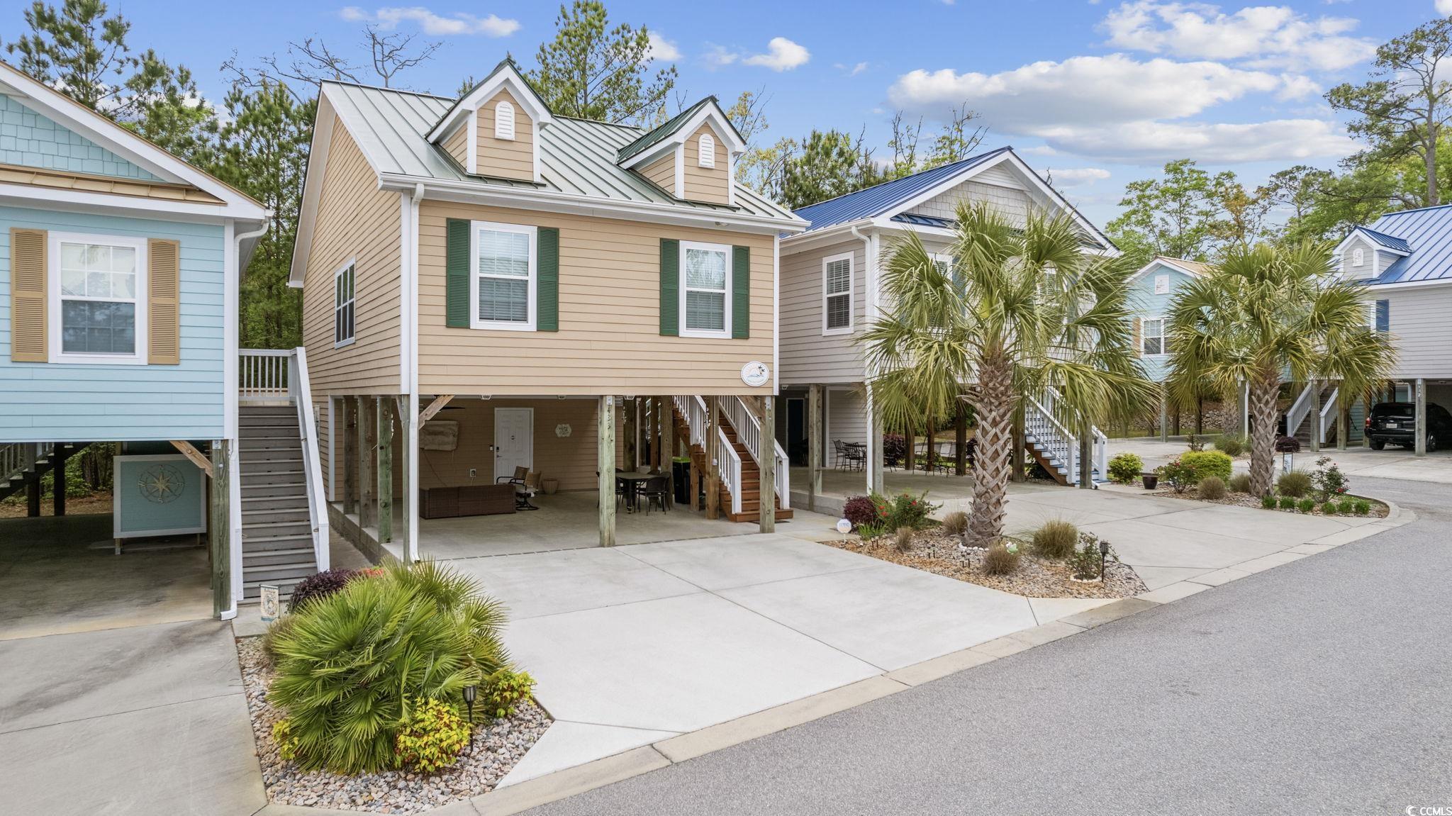 welcome to your own little piece of paradise! this charming cottage-style raised beach home is just a short walk away from the beautiful intracostal waterway. fully furnished and ready for you to move in, this home boasts a unique layout with a bedroom on the ground level, perfect for guests or a home office. step inside and you'll find a cozy living area, a spacious kitchen with all the amenities you need, and three full bathrooms for added convenience. with three bedrooms, there's plenty of space for the whole family or visiting friends. outside, relax in the covered multipurpose area and enjoy the serene surroundings or take a leisurely stroll down to the waterway for a day of boating or fishing. this home truly offers the best of beach living with a touch of southern charm. don't miss out on this perfect coastal retreat - schedule a showing today and make this beach home your own slice of paradise!