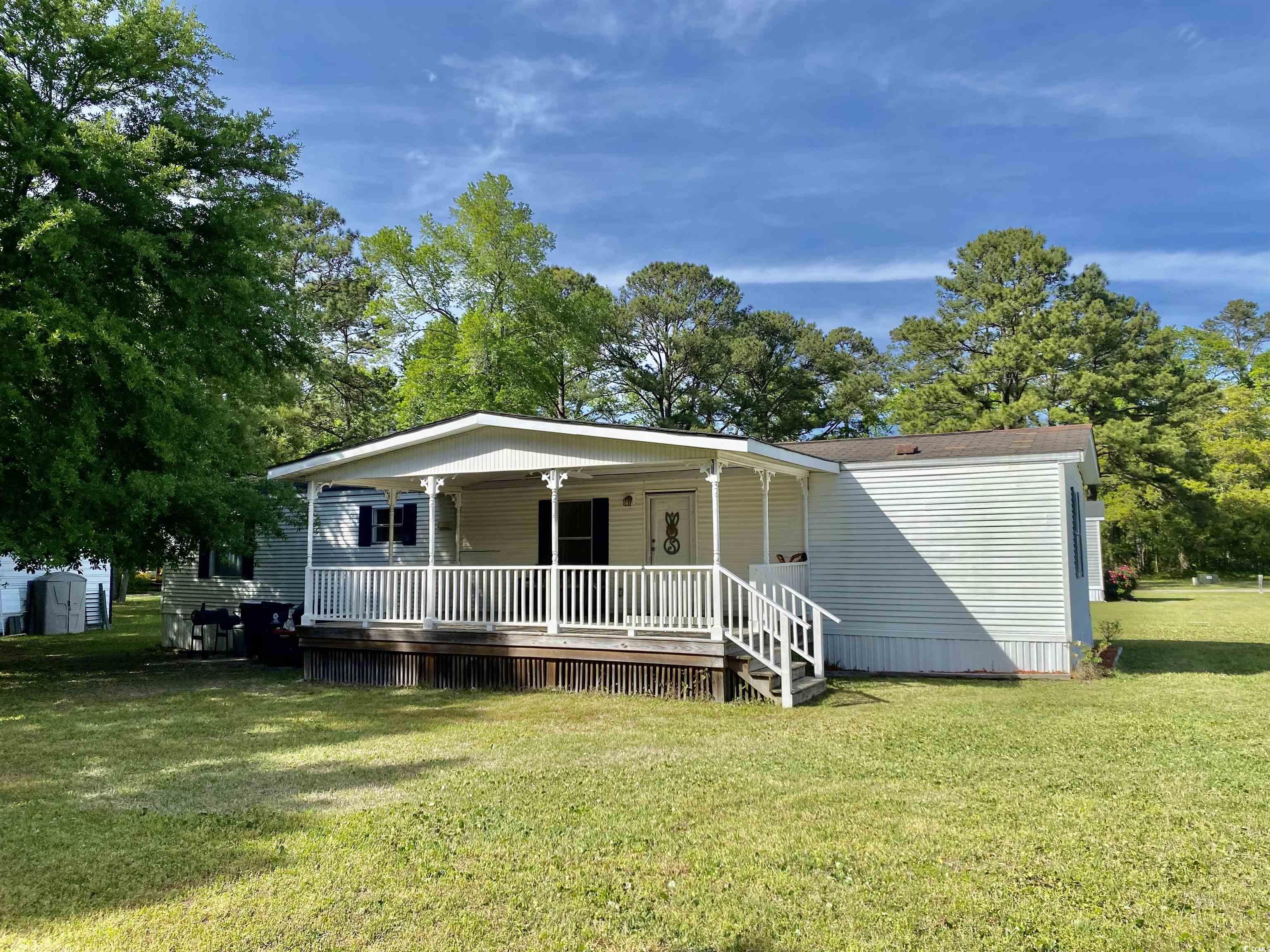 charming & well maintained 2bd/2ba manufactured home centrally located in the heart of beautiful murrells inlet, only minutes to beach, shopping and marsh walk. home is located on a large, spacious lot tucked away in a peaceful, upscale mobile home community. home features xl living area, vaulted ceilings, new laminate flooring throughout,2018 new hvac, 2023 new hot water tank, split floor plan, large porch on front of home as well as a back porch, carport for parking. relax under the shade of beautiful trees, nice outside storage unit conveys. no hoa here just the land lease! this home wont last long! call to schedule a showing today! welcome home!